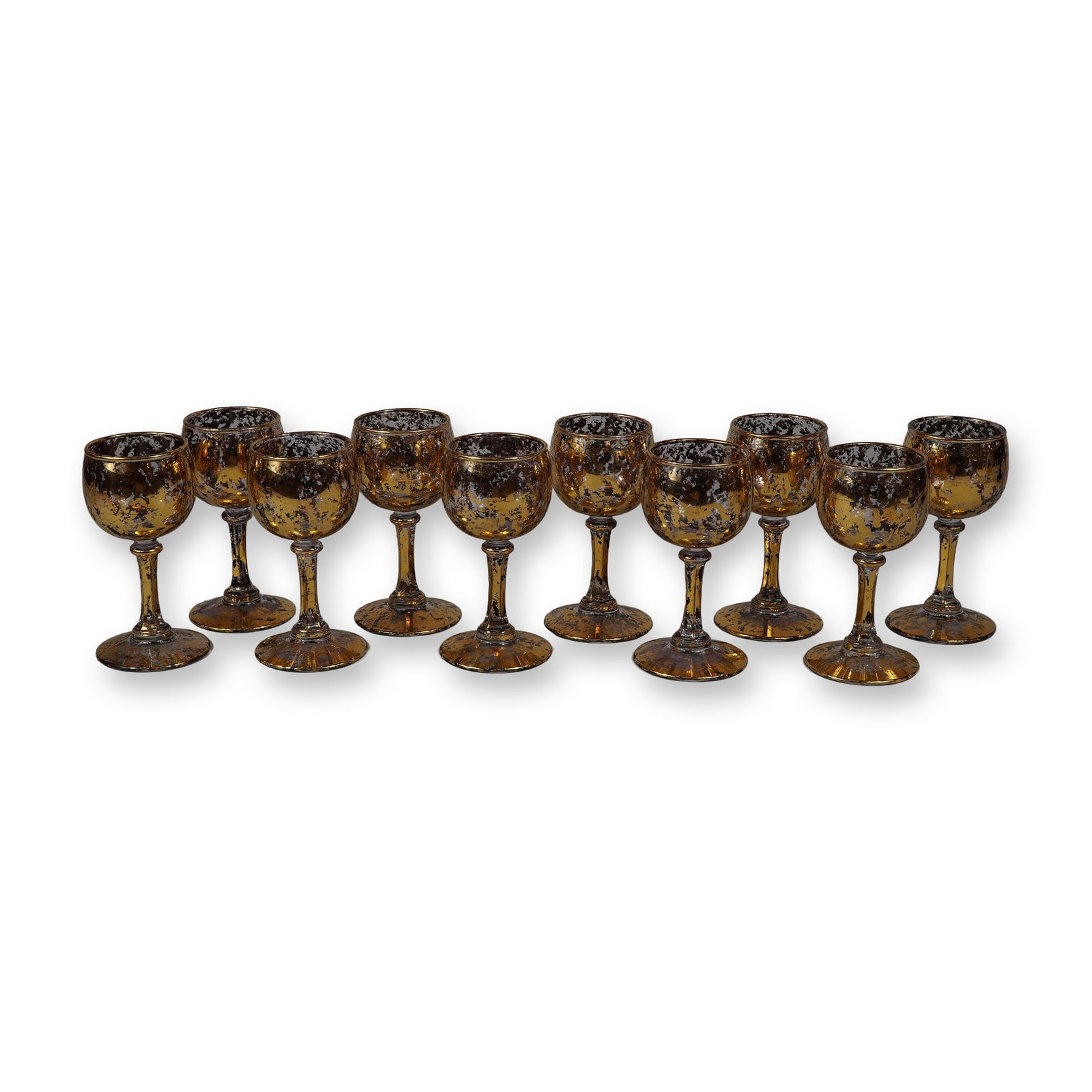 10pc Set of Vintage Gold Confetti Glass Cordial Stemware: A set of ten (10) vintage cordial glasses. These items feature a gold confetti decoration, characterized by a heavily mottled and spattered metallic finish in combined gold and silver tones over