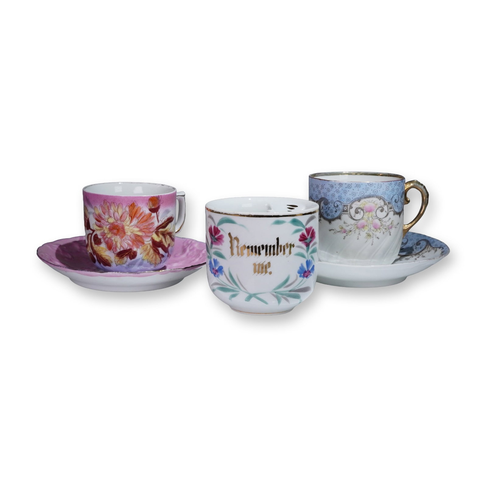 5pc Antique Porcelain Mustache Cups and Saucers: An attractive grouping of three antique porcelain cups featuring floral motifs and delicate decorations. Included is a charming porcelain mustache cup with floral decoration and gold lettering that re