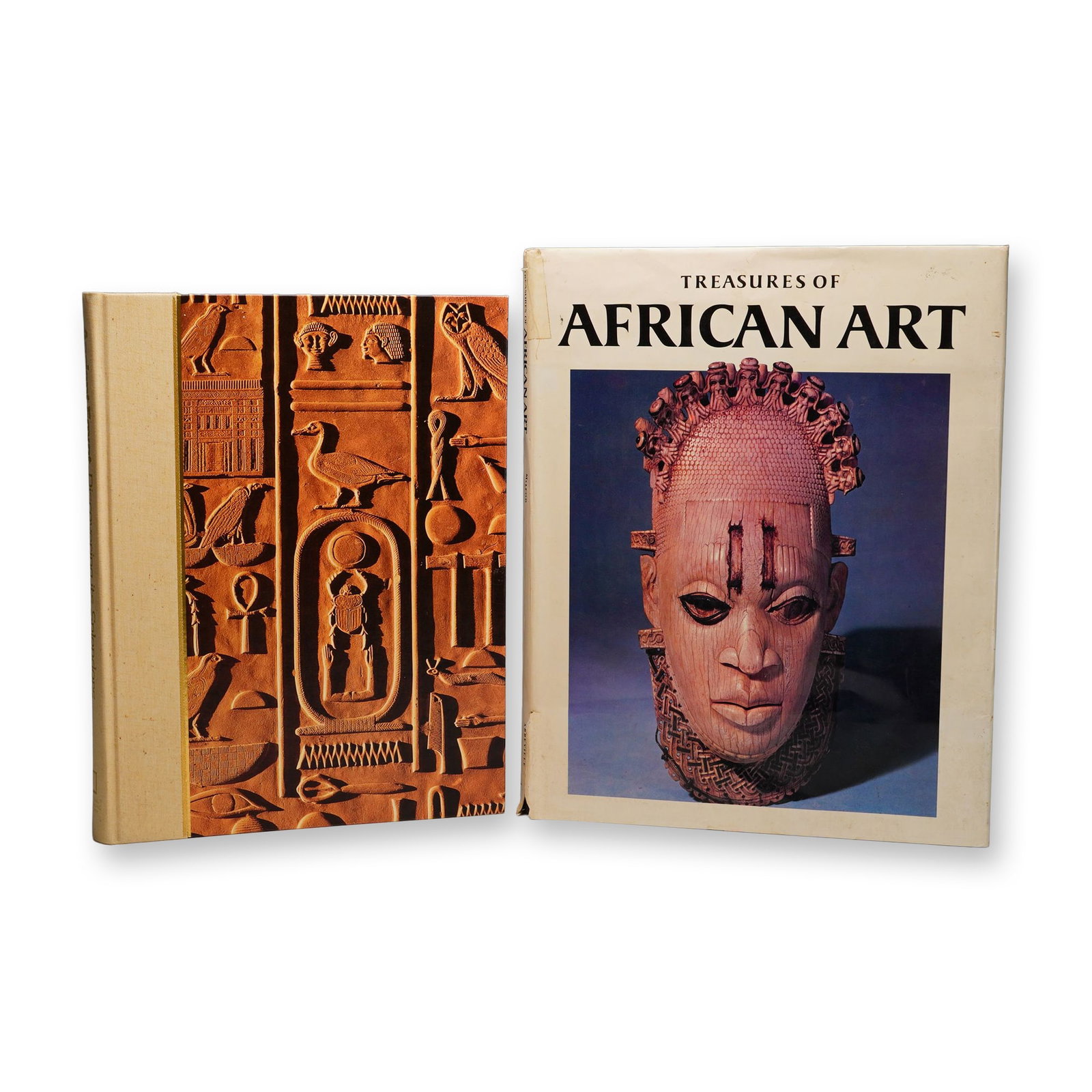 2 Art Reference Books, Treasures of African Art and Ancient Egypt: A group of two large-format hardcover art reference books. The first volume is Treasures of African Art by Malcolm McLeod, published by Abbeville Press. This volume includes an illustrated dust jacket