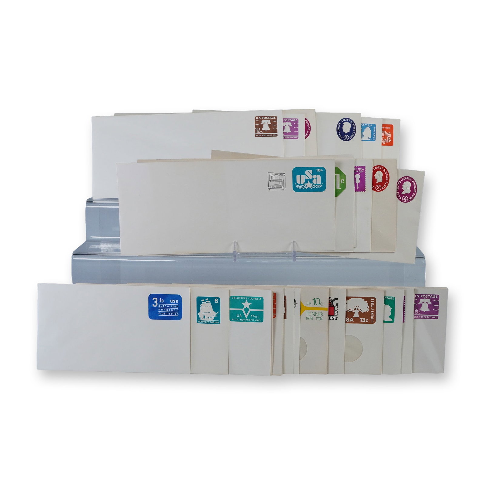 30pc Vintage US Postal Stationery Envelopes: Collection of thirty vintage United States postal stationery envelopes with pre-printed postage in assorted denominations and designs. Includes colorful examples featuring motifs such as the Liberty B