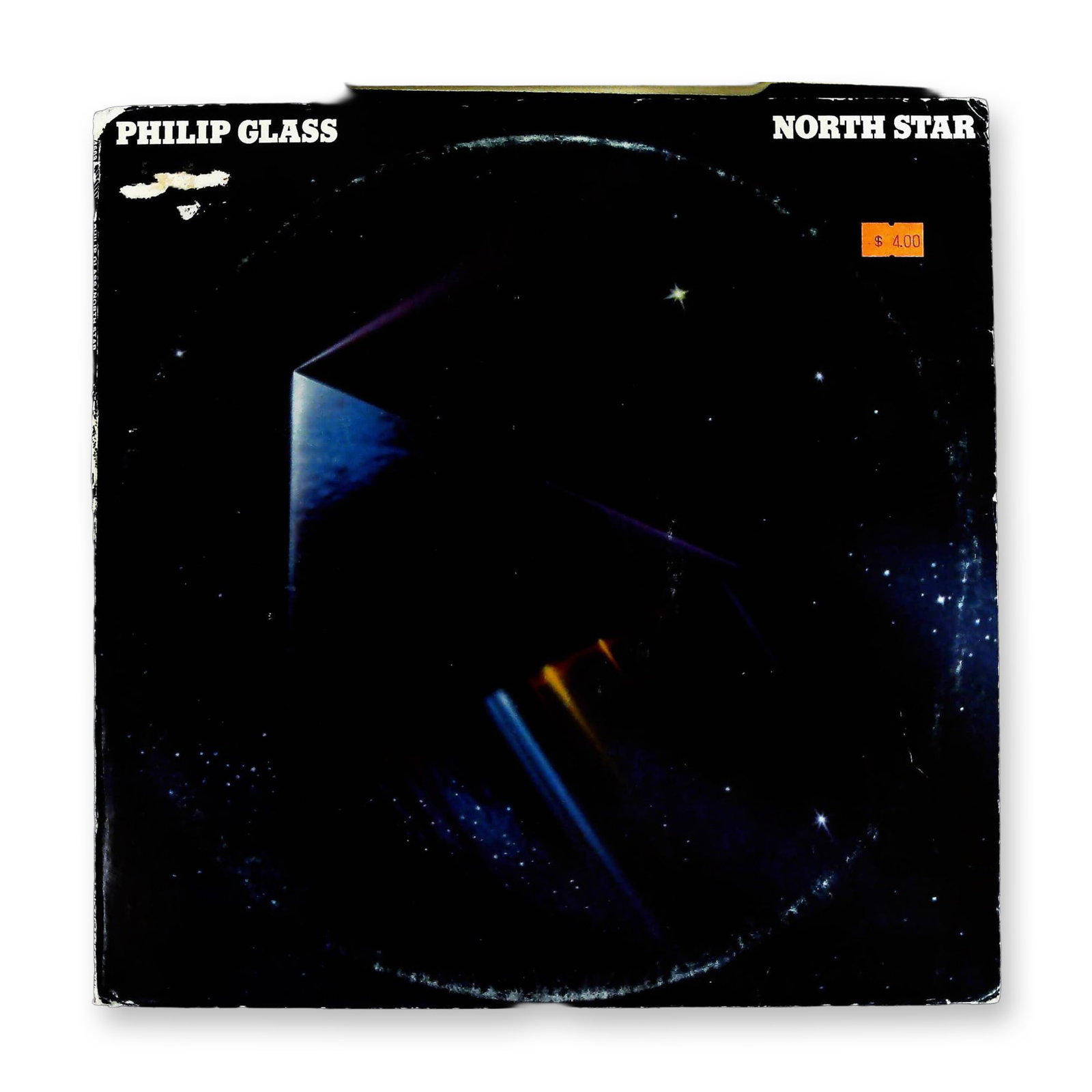 Philip Glass North Star 1977 Promotional Vinyl LP Record in Original Album Cover: A 1977 US pressing of the album North Star by composer Philip Glass, released on the Virgin Records label and distributed by CBS Records. This 12-inch vinyl LP bears the catalog number PZ 34669. The r