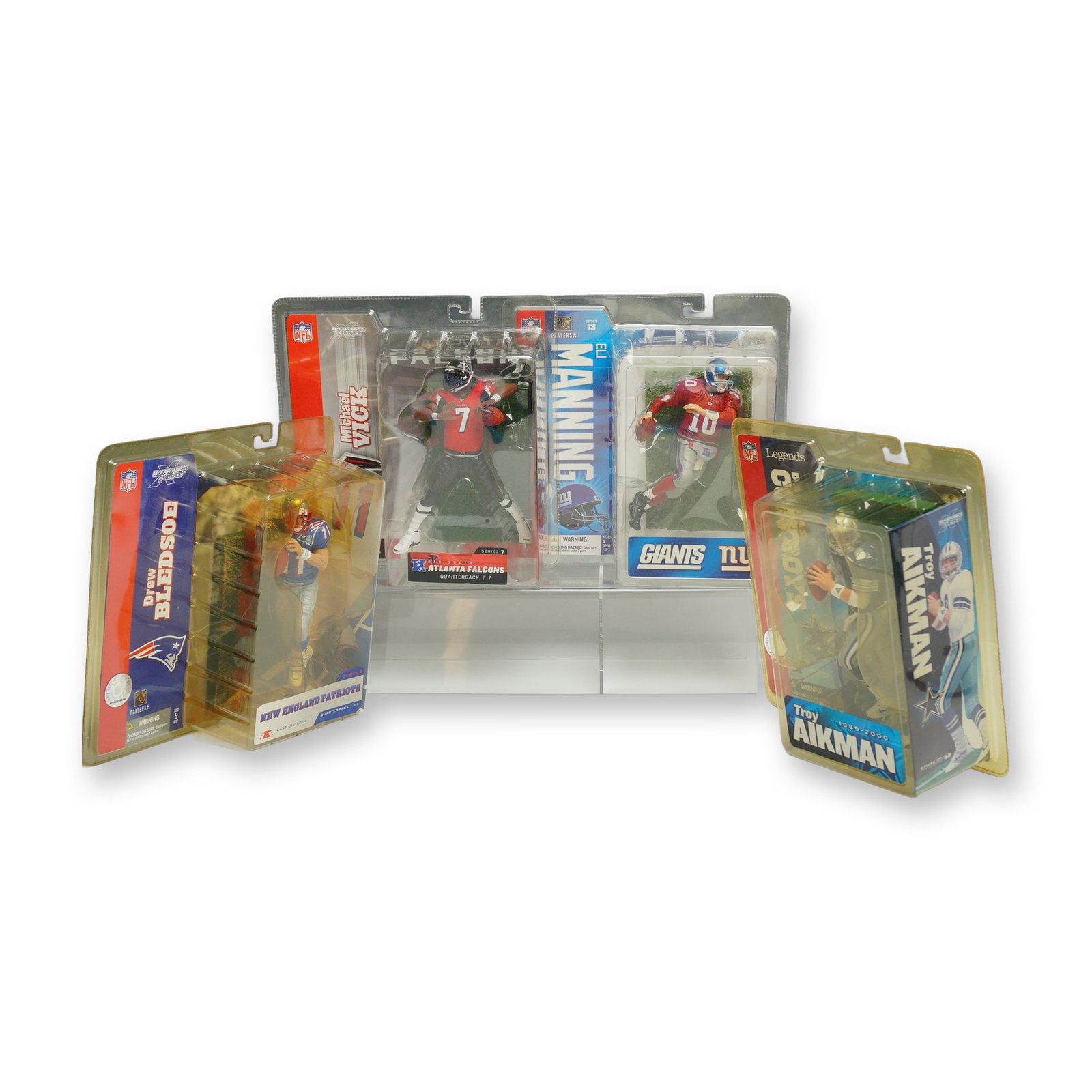 4pc Lot of McFarlane Toys NFL Sportspicks Action Figures in Original Packaging: This lot features a collection of 4pc NFL figurines in boxes manufactured by McFarlane Toys as part of their Sportspicks line. Each figure is unopened and housed in its original factory blister pack w