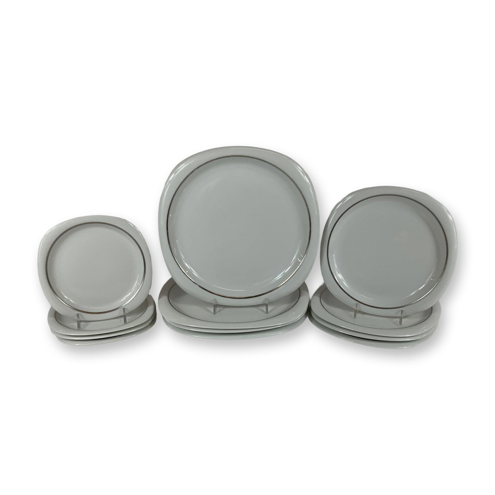 A 12-Piece Set of Rosenthal Studio-Line Suomi Lanka Porcelain Plates: A set of twelve porcelain plates manufactured by Rosenthal as part of the Studio-Line collection. The pieces feature the Suomi shape, characterized by a minimalist Modernist design with a soft square 