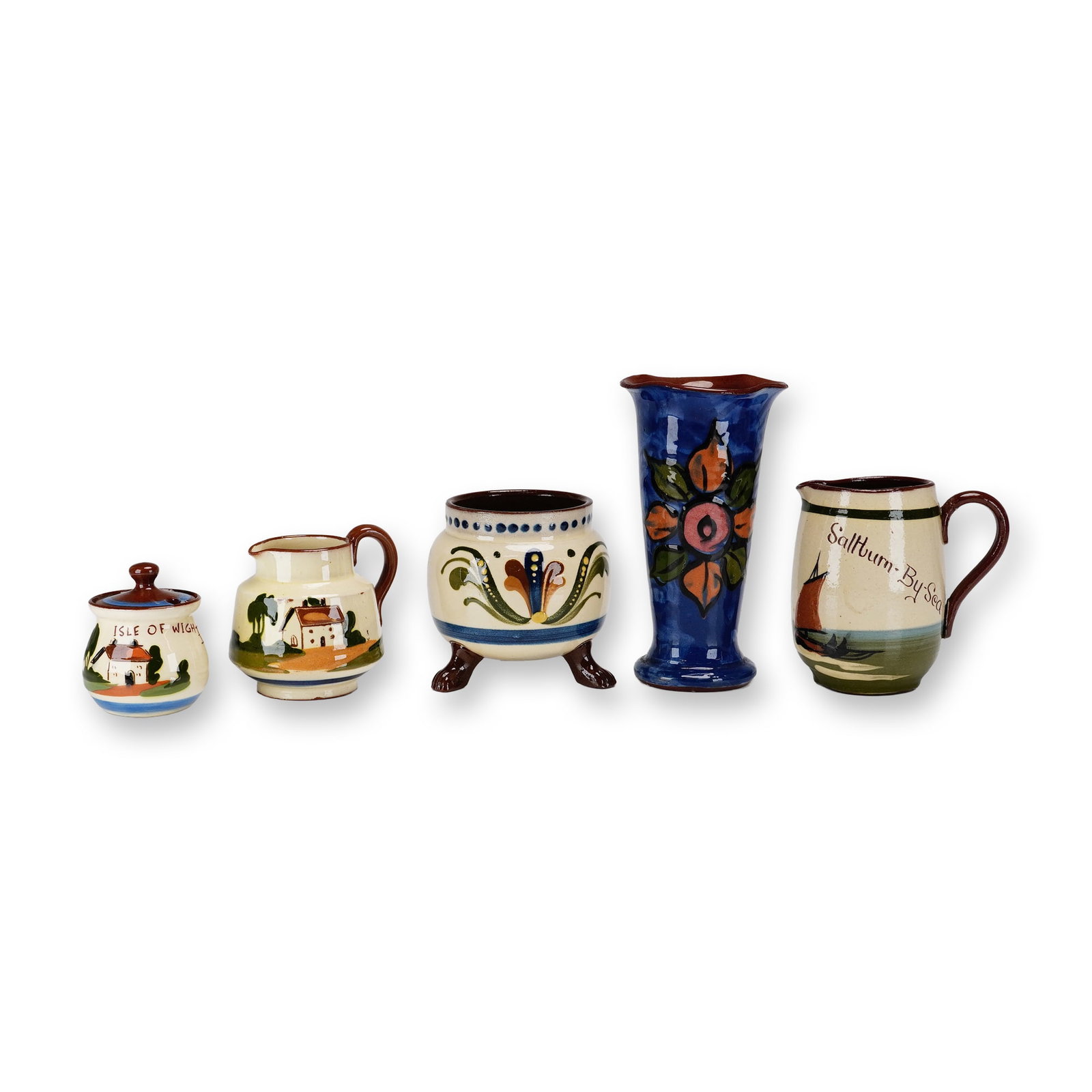 5pc English Watcombe Torquay Motto Pottery Ware: A collection of English Torquay Motto Ware, consisting of various slip-decorated red earthenware vessels. The group includes a small globular lidded pot with a knob finial, decorated with a cottage