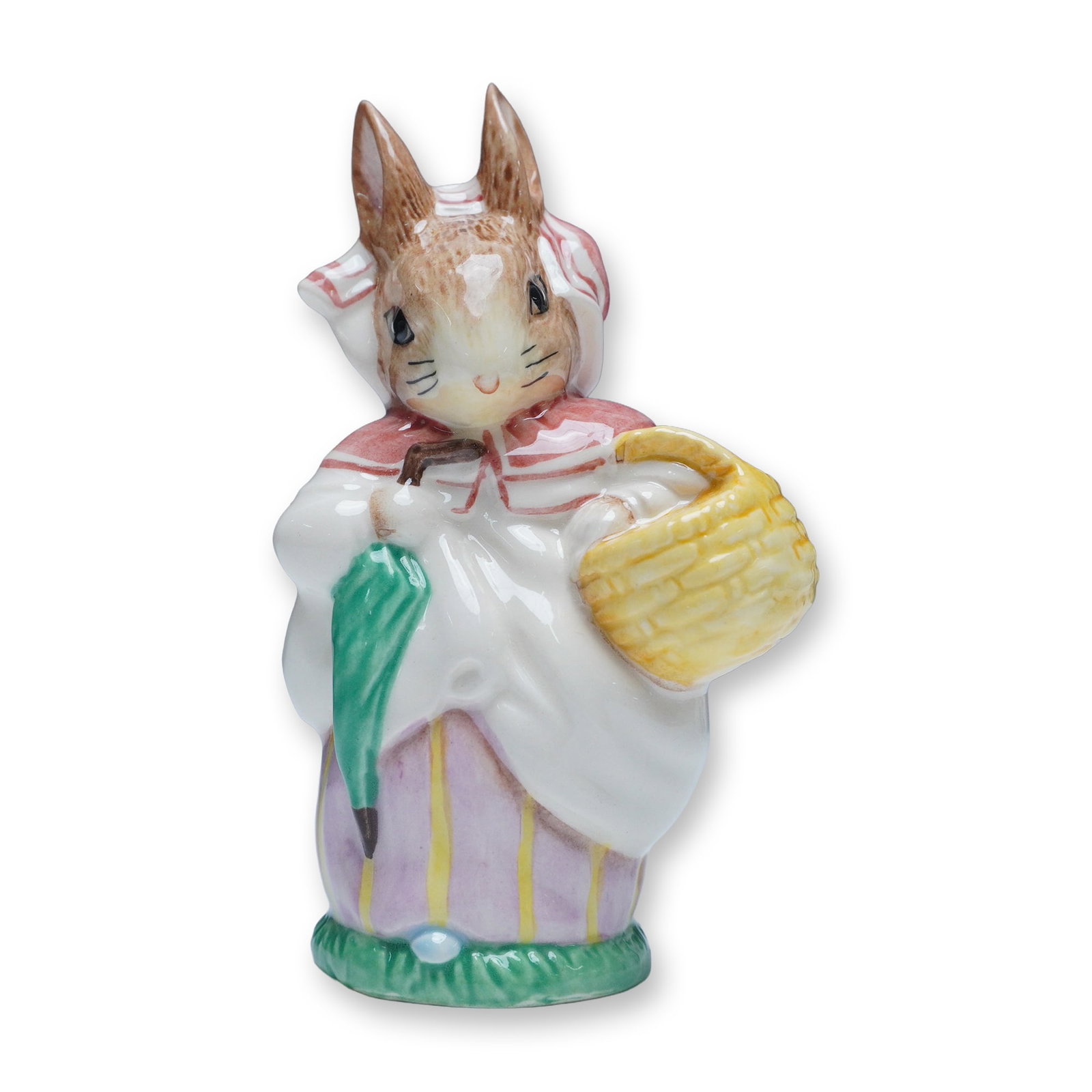 Royal Albert Beatrix Potter Mrs. Rabbit Figurine: This Royal Albert porcelain figurine features Mrs. Rabbit, a cherished character from Beatrix Potter's beloved tales. Dressed in her signature red bonnet and white apron, she carries a woven basket
