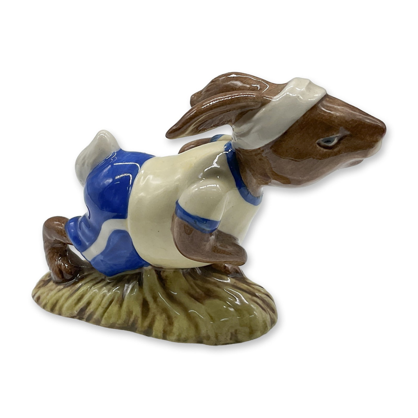 Royal Doulton Bunnykins Jogging Figurine DB228: This is a delightful Royal Doulton Bunnykins figurine titled Jogging Bunnykins, model number DB228, released in 1982. Crafted with exquisite attention to detail, this hand-painted porcelain figurine