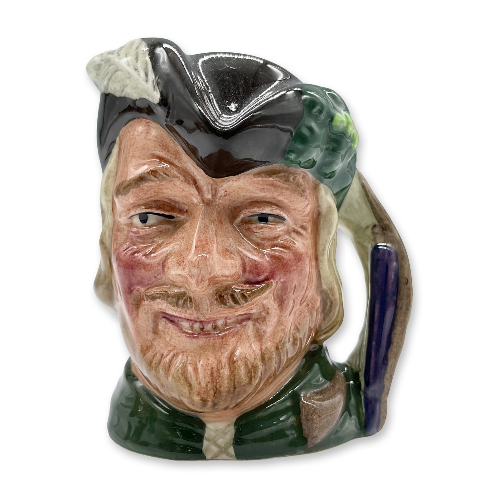 Robin Hood New D6541 - Mini - Royal Doulton Character Jug: Style Two. Brown hat with white feather on one side and oak leaves and acorns on the other; green robes. Royal Doulton backstamp. Artist: Max Henk Dimensions: 2.5"L x 2.25"W x 2.75"H Date or Era: 1960