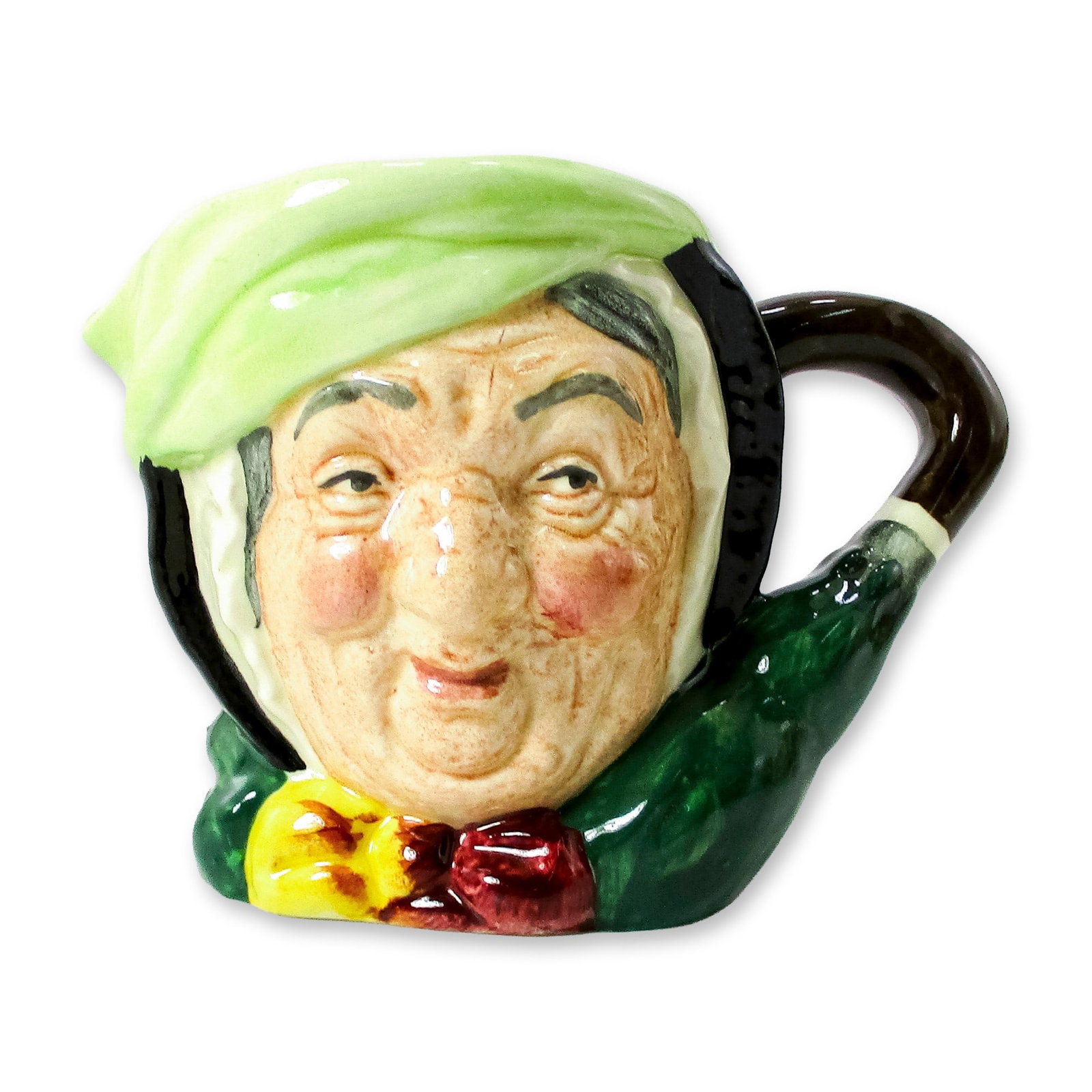 Sairey Gamp D5528 - Small - Royal Doulton Character Jug: Black hair; light green band; dark green coat; yellow and burgundy bow; green umbrella with brown handle. In Charles Dickens' 1843 novel, "Martin Chuzzlewit" Sairey Gamp is a gossiping, gin-drinking m