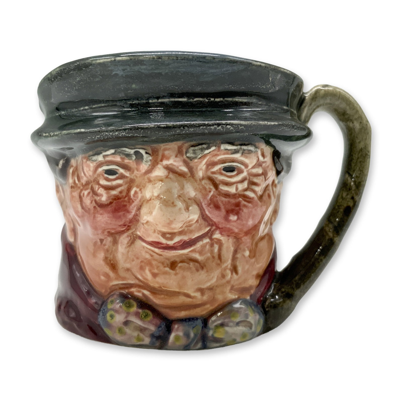 Tony Weller D6044 - Mini - Royal Doulton Character Jug: Dark grey hat; maroon coat; grey-white bow with yellow spots. Royal Doulton backstamp. Artist: Leslie Harradine and Harry Fenton Dimensions: 2.25"H Date or Era: 1939 - 1960 Manufacturer or Brand: Roya
