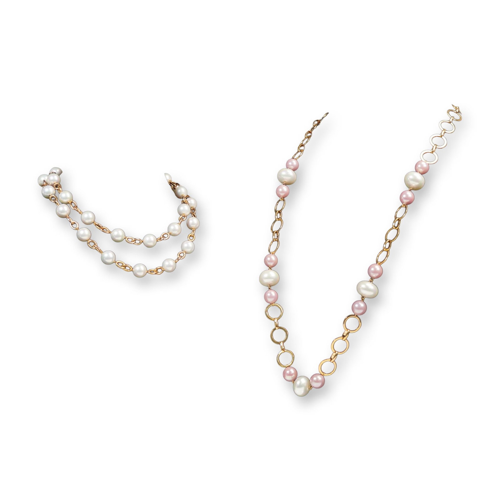 2pc Gold Tone Link Necklaces with Simulated Pearls: Pair of gold tone link necklaces featuring simulated pearls in classic and blush pink tones. Each necklace incorporates oversized faux pearls joined with gold tone chain links, offering a stylish and 