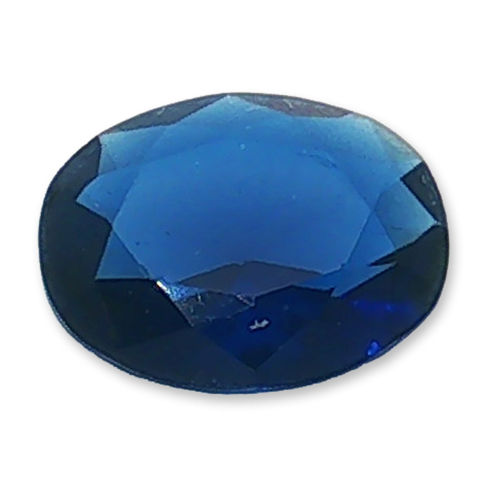 Oval Cut Royal Blue Loose Iolite: Loose faceted gemstone appearing to be iolite, featuring a saturated royal blue hue and a deep, rich color profile. The stone is cut in an oval shape with facets designed to catch and reflect light th