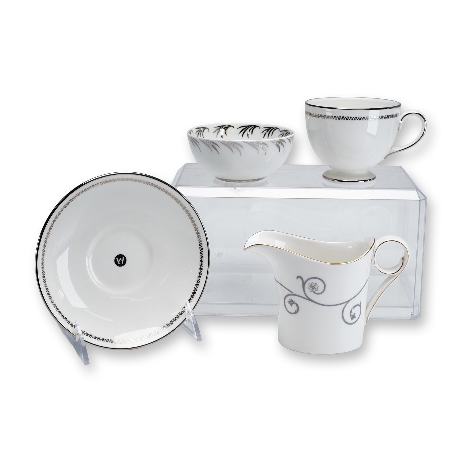 4pc Wedgwood Fine Bone China Coffee Cup and Saucer, Creamer, and Bowl: This group of four Wedgwood fine bone china pieces includes a coffee cup and matching saucer decorated with a black geometric Greek key border and platinum-toned trim, a Time for Wedgwood creamer feat