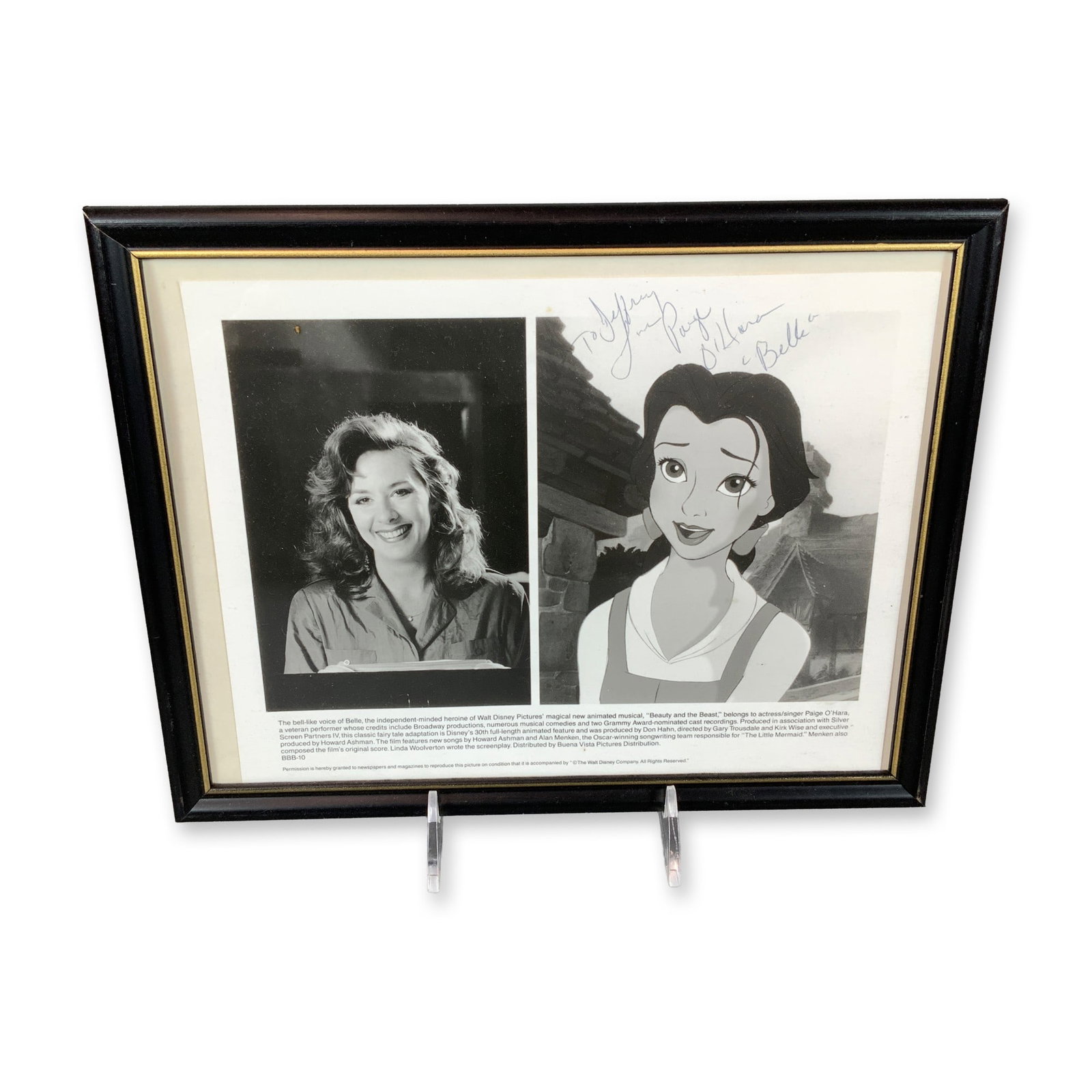 Framed Autographed Photo of Paige O'Hara and Belle from Disney's Beauty and the Beast: This framed, autographed publicity photograph for Walt Disney Pictures' 1991 feature Beauty and the Beast features a composite of two black-and-white images: a film still of Belle and a promotional he
