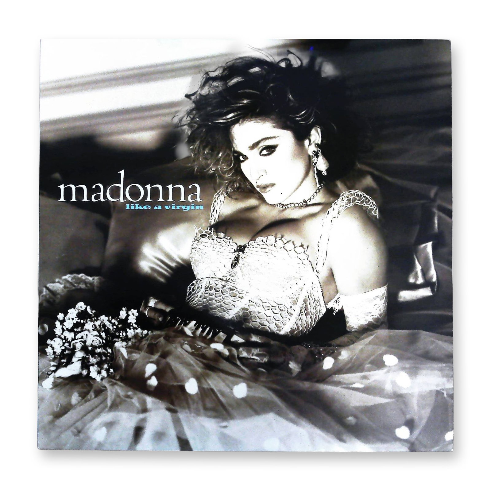 Madonna Like A Virgin Vintage Vinyl LP Album Sire Records 1-25157: A single vintage vinyl LP record album, Madonna's "Like A Virgin," released by Sire Records. The album is housed in its original printed cardboard sleeve featuring stylized black and white photography