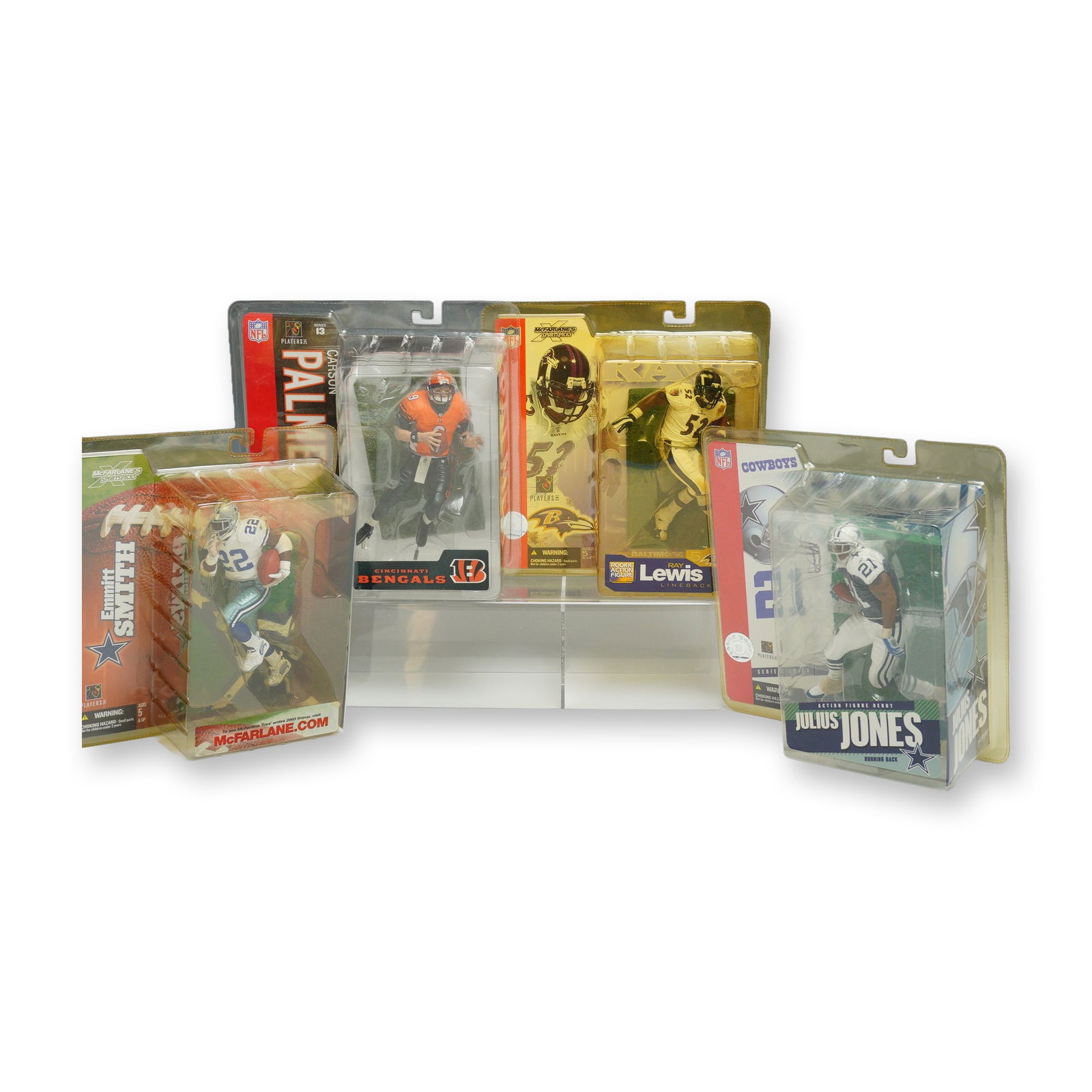 A 4pc Lot of McFarlane Toys NFL SportsPicks Action Figures: A collection of four NFL SportsPicks action figures produced by McFarlane Toys, each in its original, unopened blister pack packaging. The group includes Carson Palmer of the Cincinnati Bengals from S