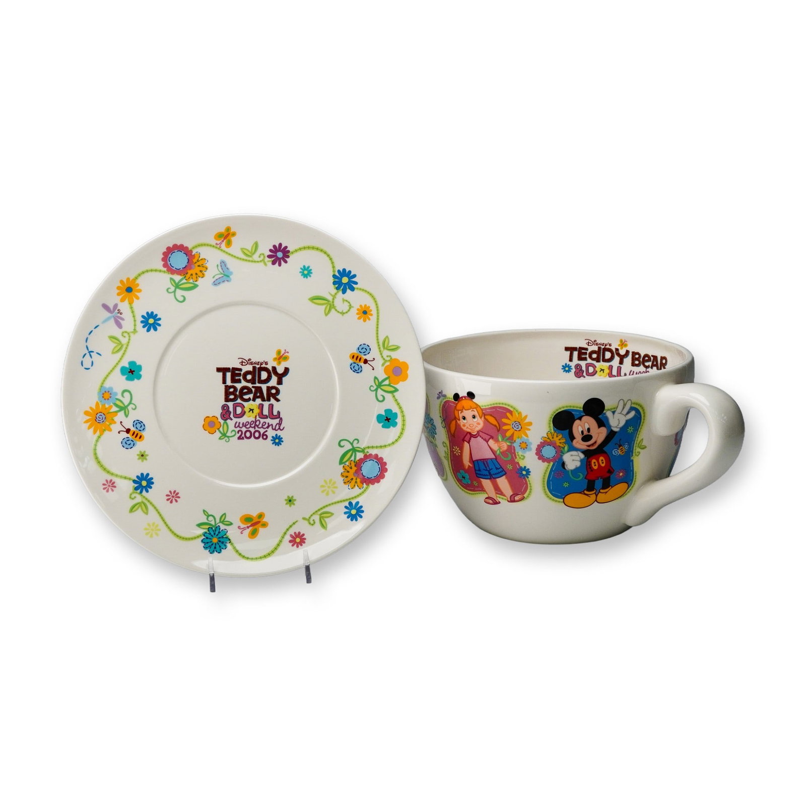 Disney Teddy Bear & Doll Weekend 2006 Oversized Decorative Cup and Saucer: Commemorating Disney's Teddy Bear & Doll Weekend 2006, this oversized decorative cup and saucer set features vibrant floral artwork with Mickey Mouse and a young girl in cheerful celebration. The colo