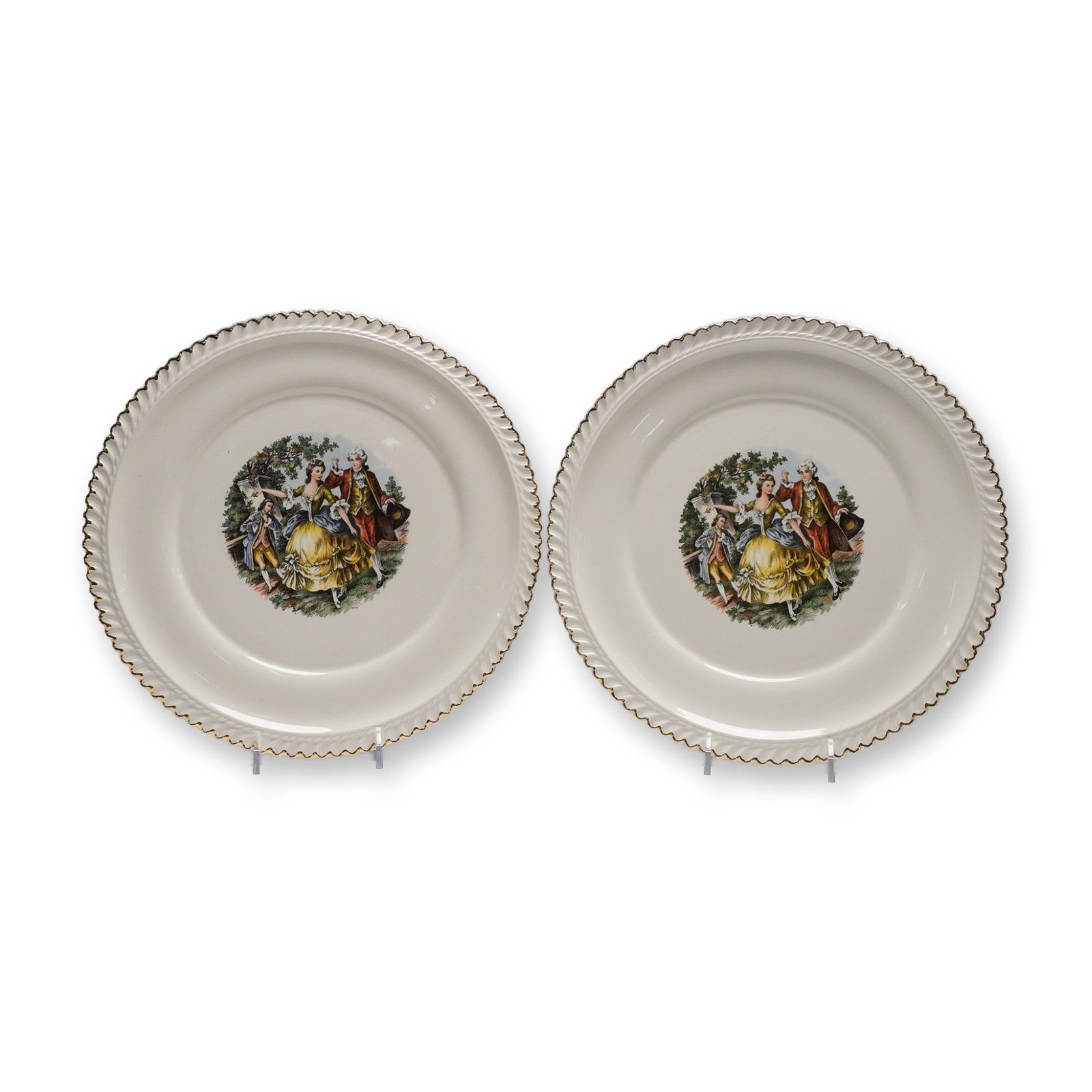 2pc The Hacker Pottery Plates, 22KT Gold Rim Courting Scene: Pair of vintage decorative plates by The Hacker Pottery, each showcasing a central transfer scene of a romantic 18th-century courting couple with a flute player in a lush garden setting. The plates fe