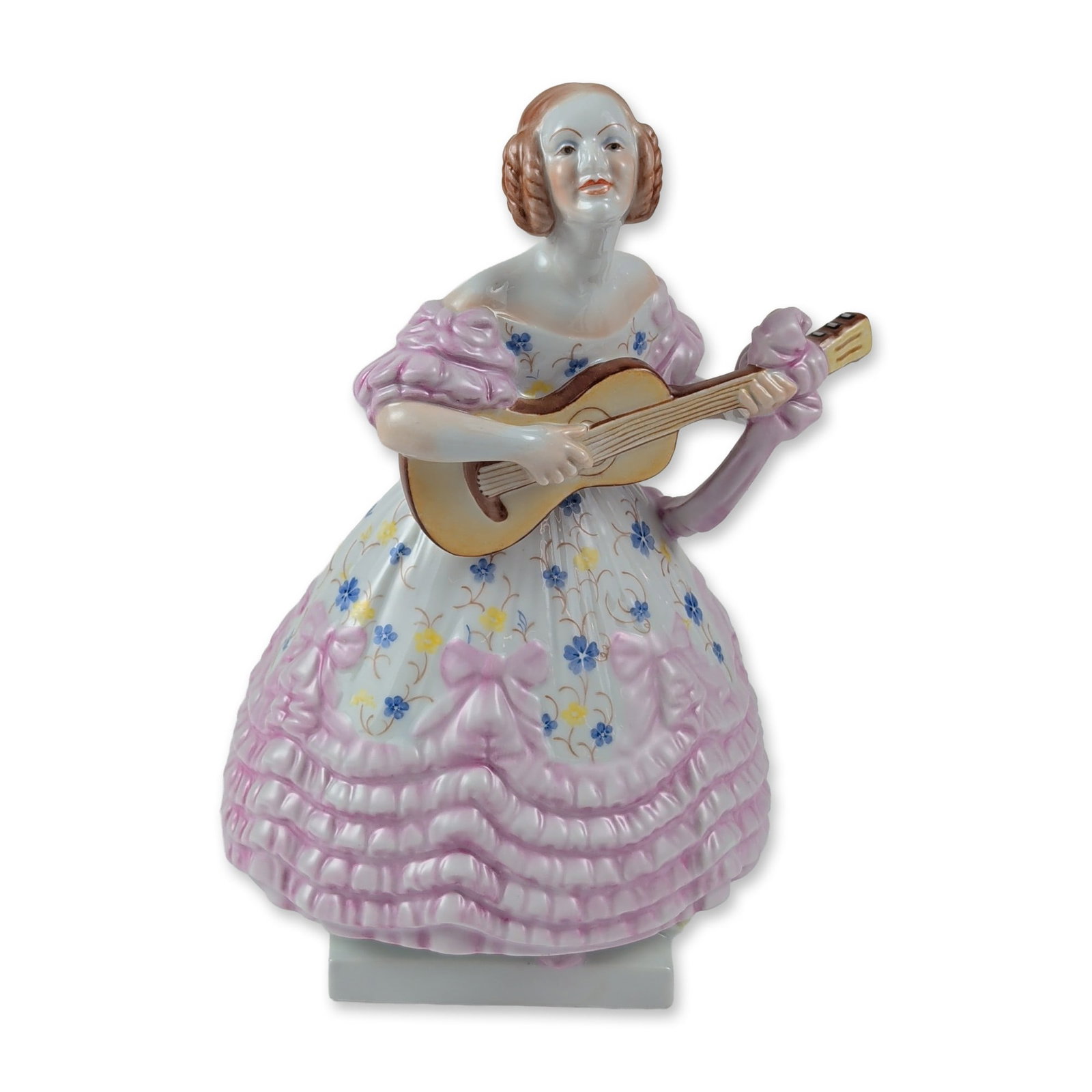 Herend Hungary Porcelain Deryne Guitarist Figurine: Herend, Hungary. Hand-painted porcelain figurine depicting the opera singer Deryne playing a guitar. The figure is depicted wearing a white floral-decorated bodice and a voluminous pink multi-tiered r