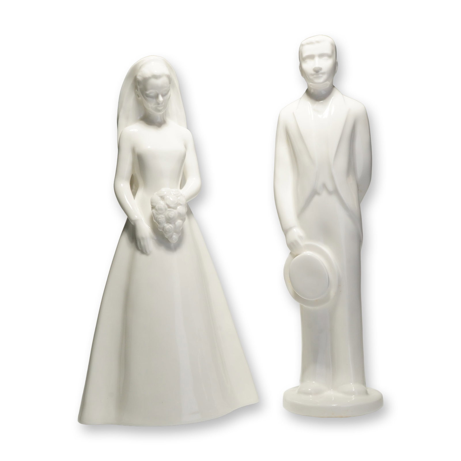 2pc Coalport Moments Bone China Figurines, The Bride and The Groom: A duo of white glazed bone china figurines from the Moments by Coalport collection, titled The Bride and The Groom. These contemporary-style figures are rendered with a high-gloss monochromatic finish