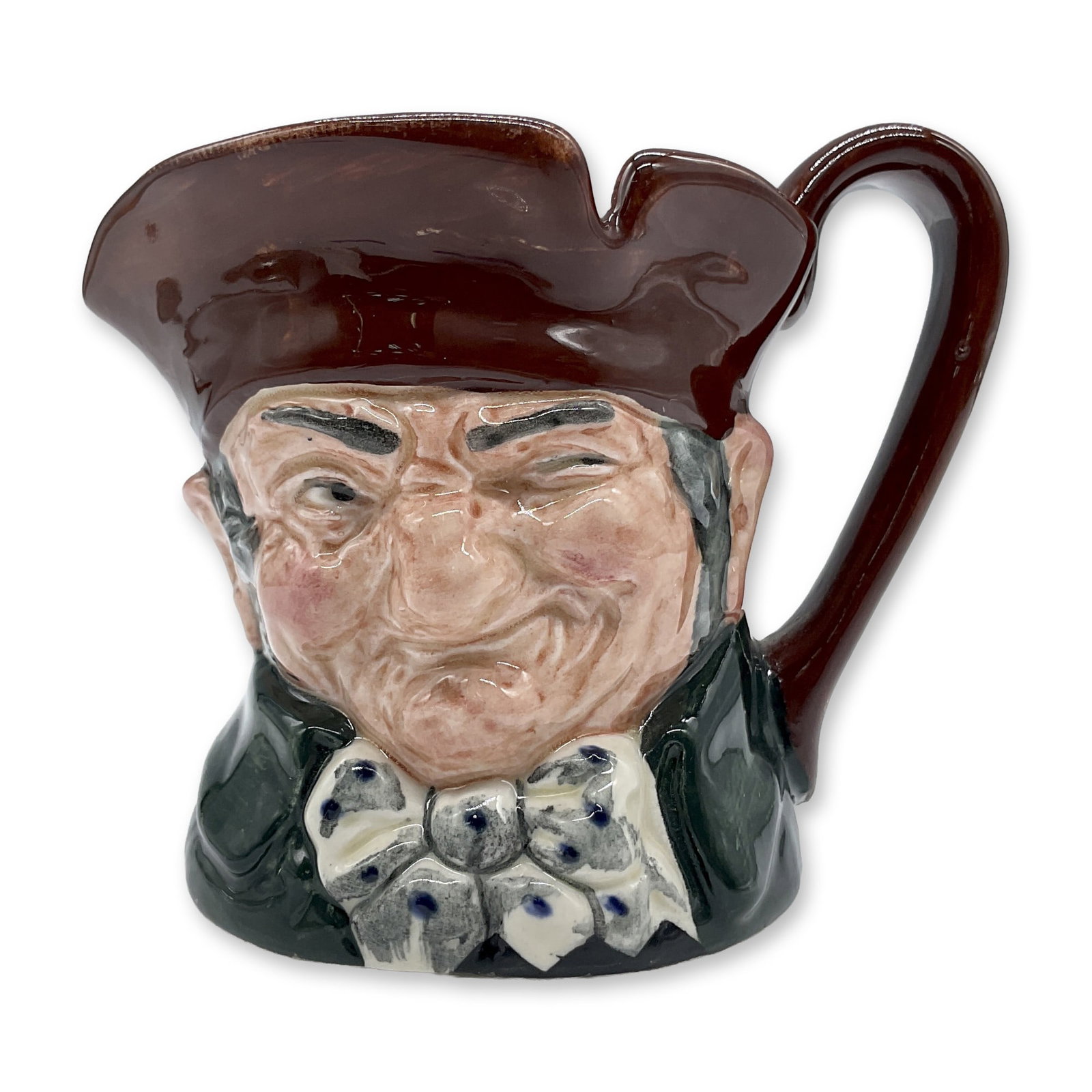 Old Charley D5527 - Small - Royal Doulton Character Jug: Brown hat; dark green coat; blue polka- dot bow tie. Royal Doulton backstamp. Artist: Charles J. Noke Dimensions: 3.25"H Date or Era: 1935 - 1983 Manufacturer or Brand: Royal Doulton Country of Or