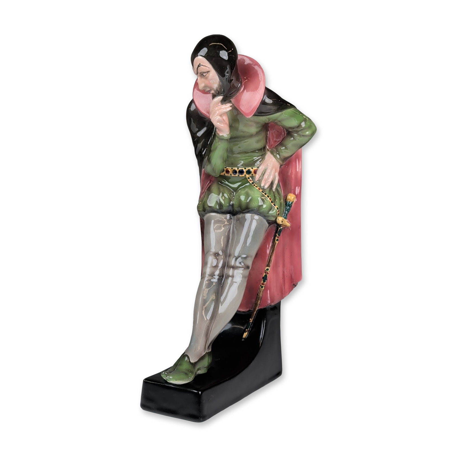 Goldscheider by Josef Lorenzl Ceramic Figurine, Mephisto 5537: Art Deco ceramic figurine depicting Mephistopheles from Goethes Faust, designed by Josef Lorenzl . The figure is modeled in a recumbent pose leaning against a black L-shaped base. Construction is poly