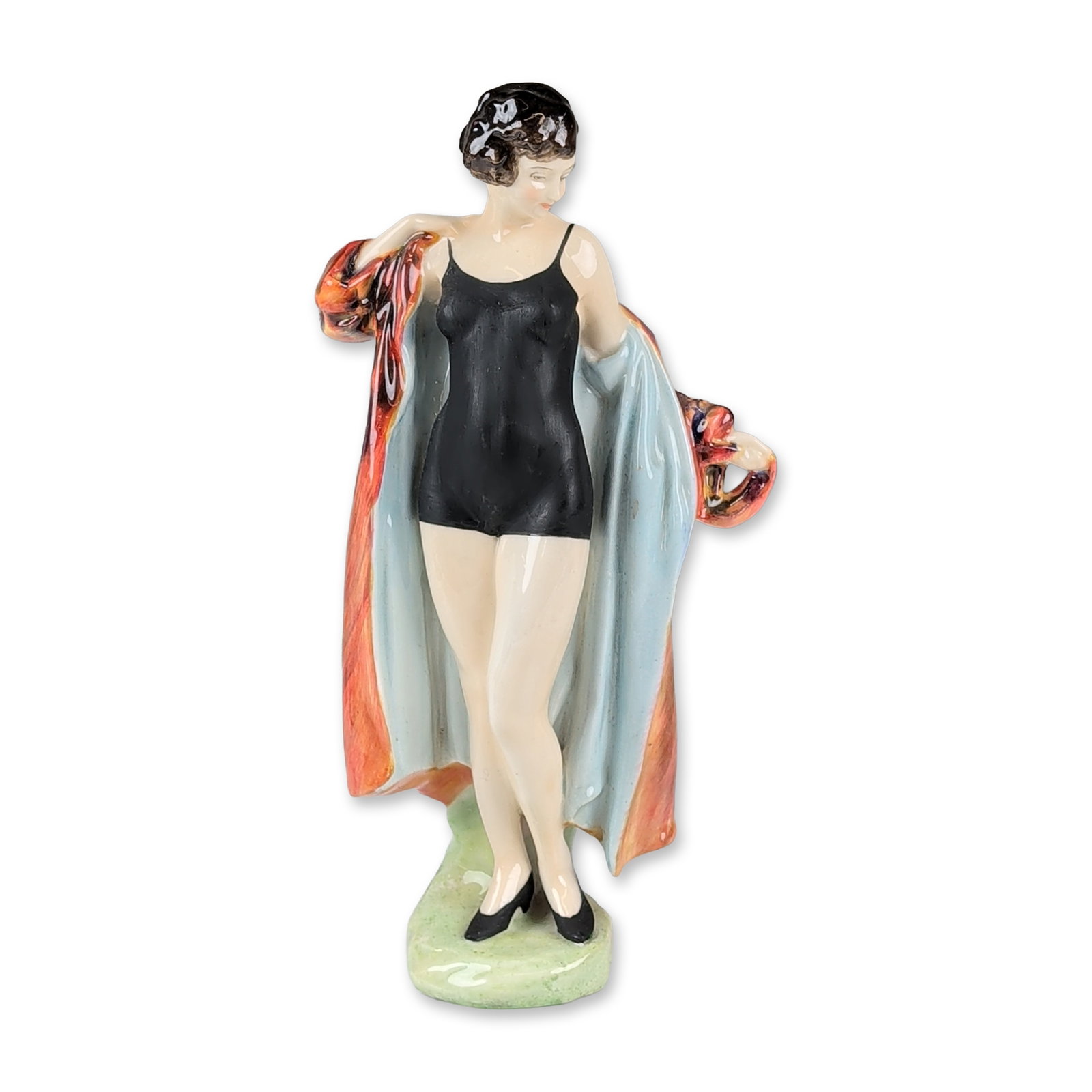 Royal Doulton Colorway Figurine, Bather HN1708: Designed by Leslie Harradine. The figure depicts a woman in a matte black one-piece bathing suit and black heeled shoes, draped in a glossy flowing robe featuring a variegated glaze in tones of orange