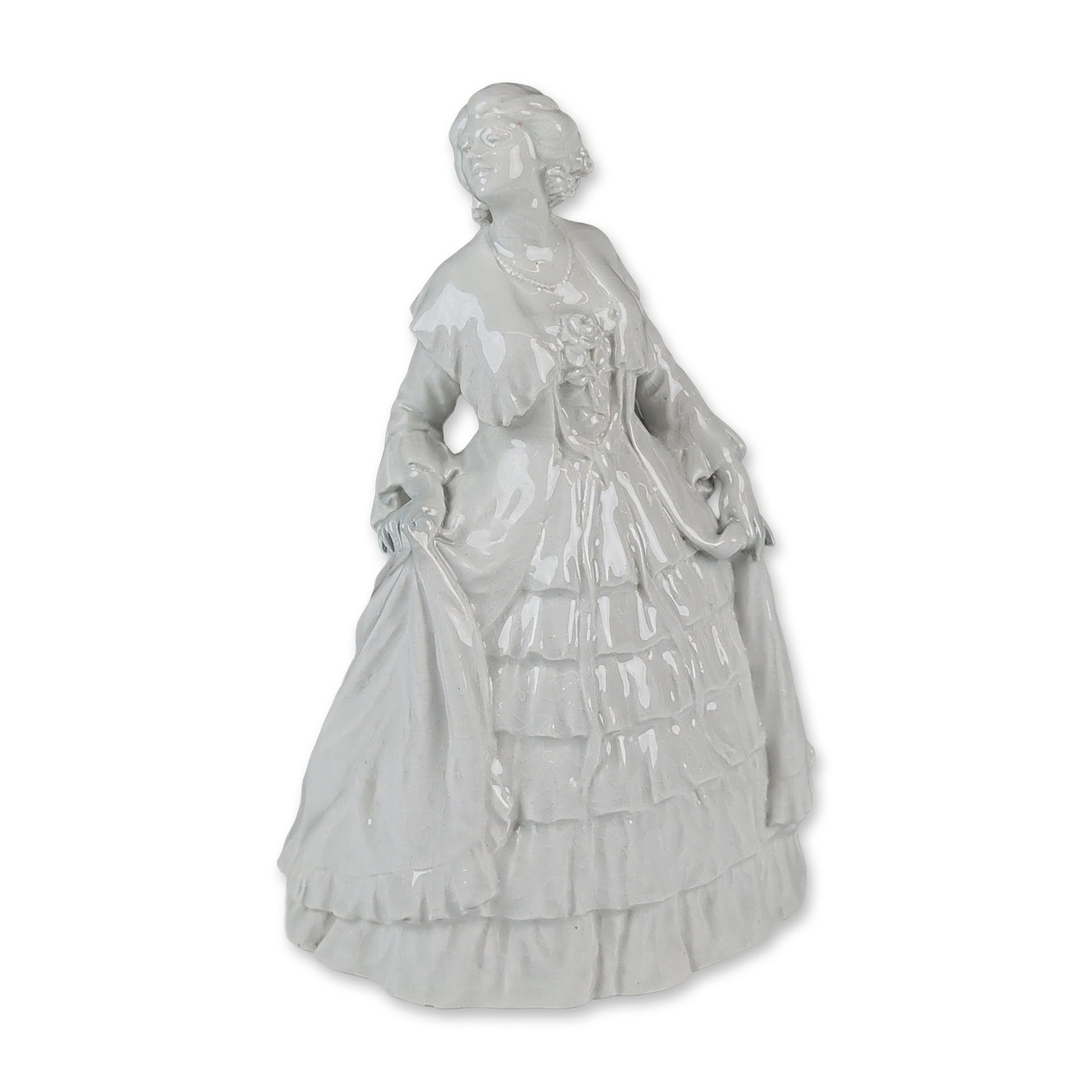Doulton Lambeth by John Broad Glossy Stoneware Figurine, Doris Keane - The Minuet: A figurine of a lady in 18th-century style dress, finished in a white gloss glaze. The figure is depicted in an elaborate gown featuring a multi-tiered ruffled skirt, frilled collar, and decorative bo