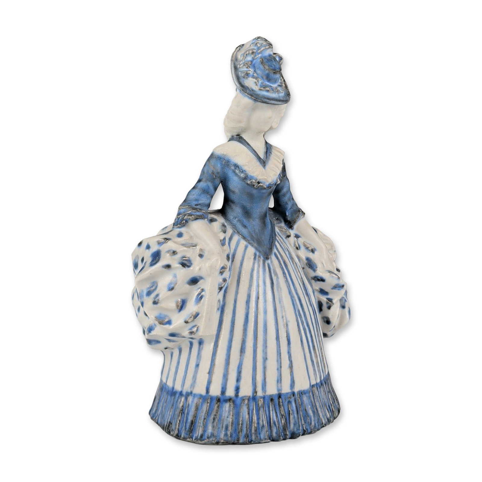 Royal Doulton by Mark V. Marshall Stoneware Blue and White Figurine, 18th Century Figure with Fan: The figure is decorated in a blue and white palette, featuring a wide pannier skirt with vertical stripes and large polka dot patterns on the puffed sleeves and side panels. She wears a blue bodice wi