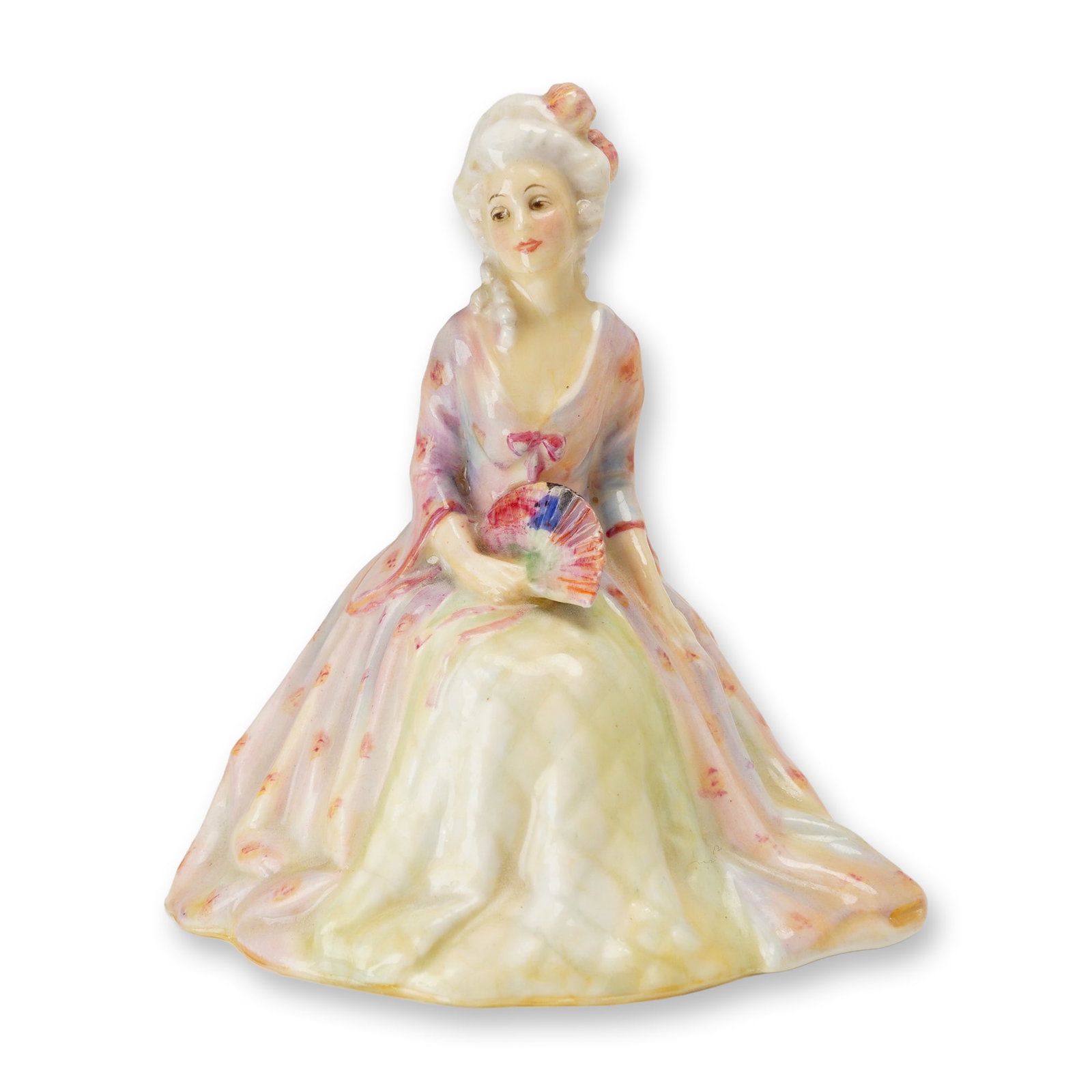 Royal Doulton Porcelain Figurine, Eugene HN1520: Part of the Regency series, designed by Leslie Harradine. Hand-painted figurine depicting a lady in an elegant pink and green gown, holding a decorative fan. Royal Doulton backstamp. Artist: Leslie Ha