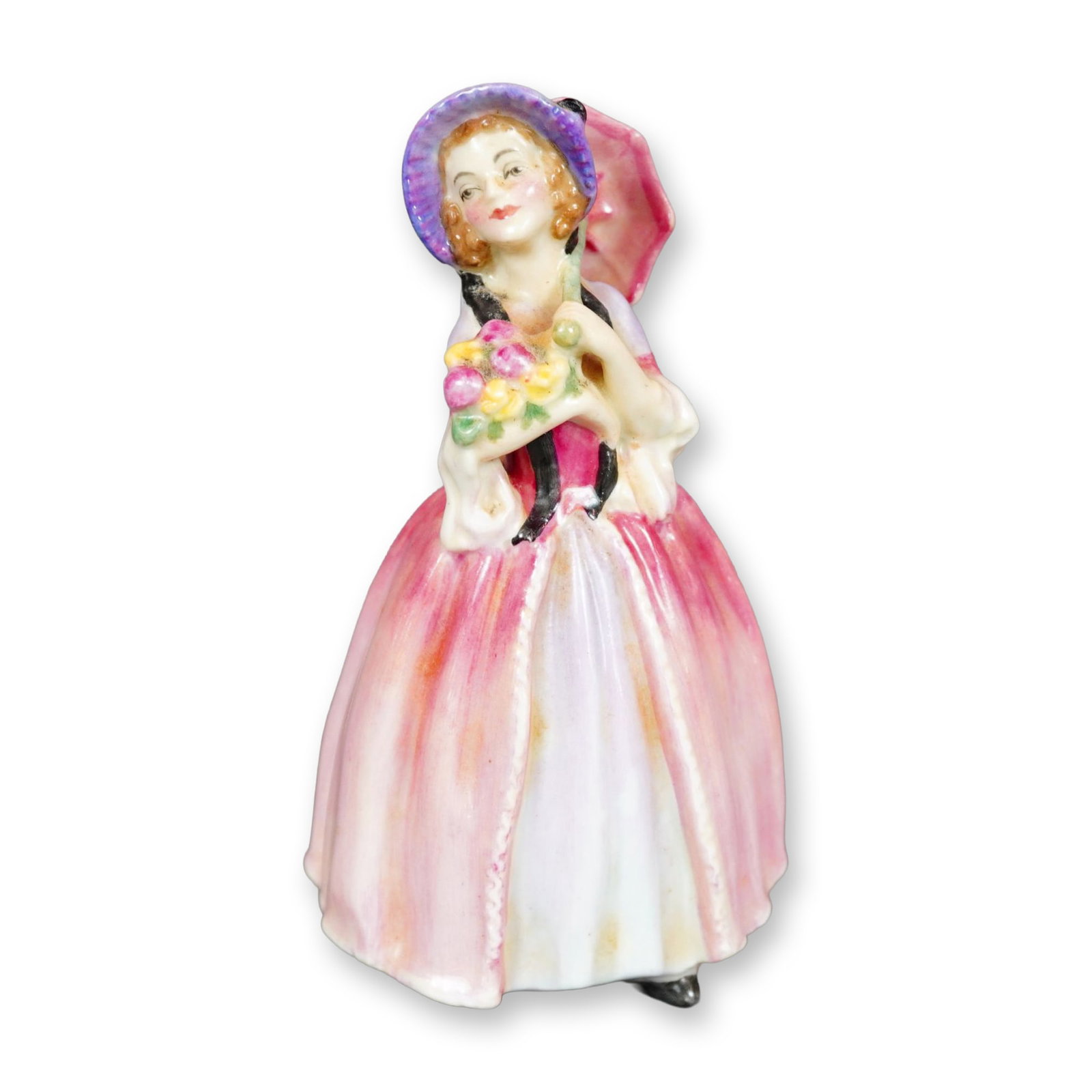 Royal Doulton Bone China Figurine, June M65: Hand painted figurine of a woman in a pink own, holding pink and yellow flowers in her arm, and a pink parasol over her head. Royal Doulton backstamp. Dimensions: 2.5"L x 2.25"W x 4.5"H Manufacturer o