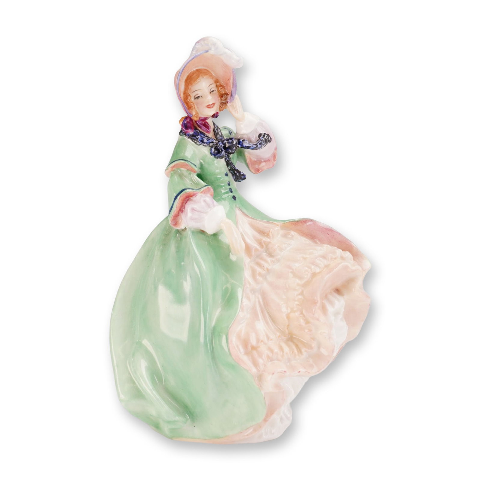 Royal Doulton Bone China Figurine, Spring Morning HN1923: Designed by Leslie Harradine, the figure depicts a young woman in an 18th-century style windblown gown of pale green, lifted to reveal tiered pink ruffles. She is modeled wearing a feathered bonnet wi