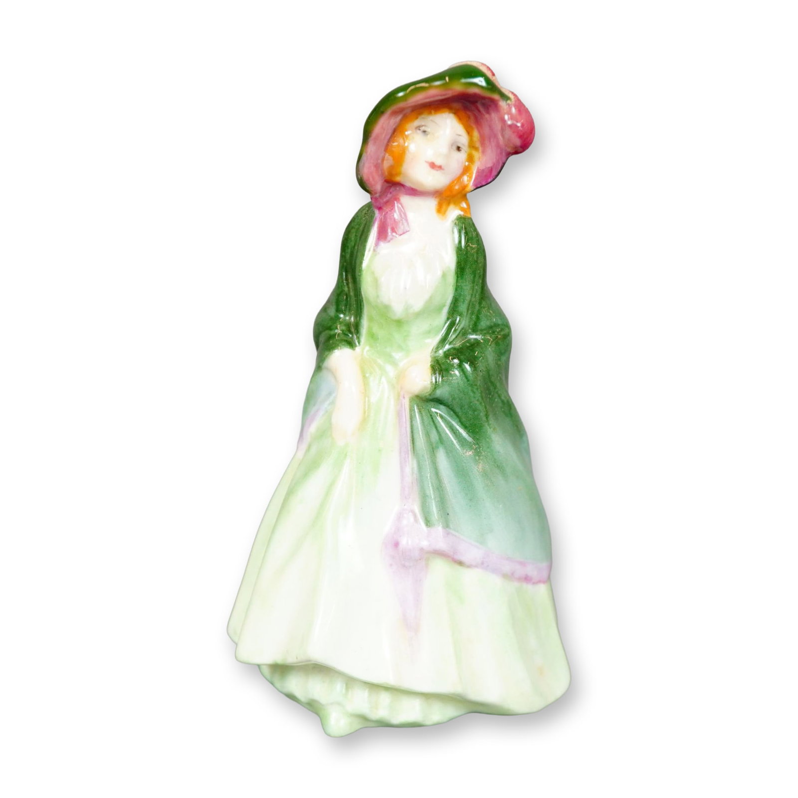 Royal Doulton Figurine, Paisley Shawl M26: Hand painted figure of a young woman in a long green dress, shawl, and hat with pink accents. Royal Doulton backstamp. Dimensions: 2.25"L x 2.25"W x 4"H Manufacturer or Brand: Royal Doulton Country of
