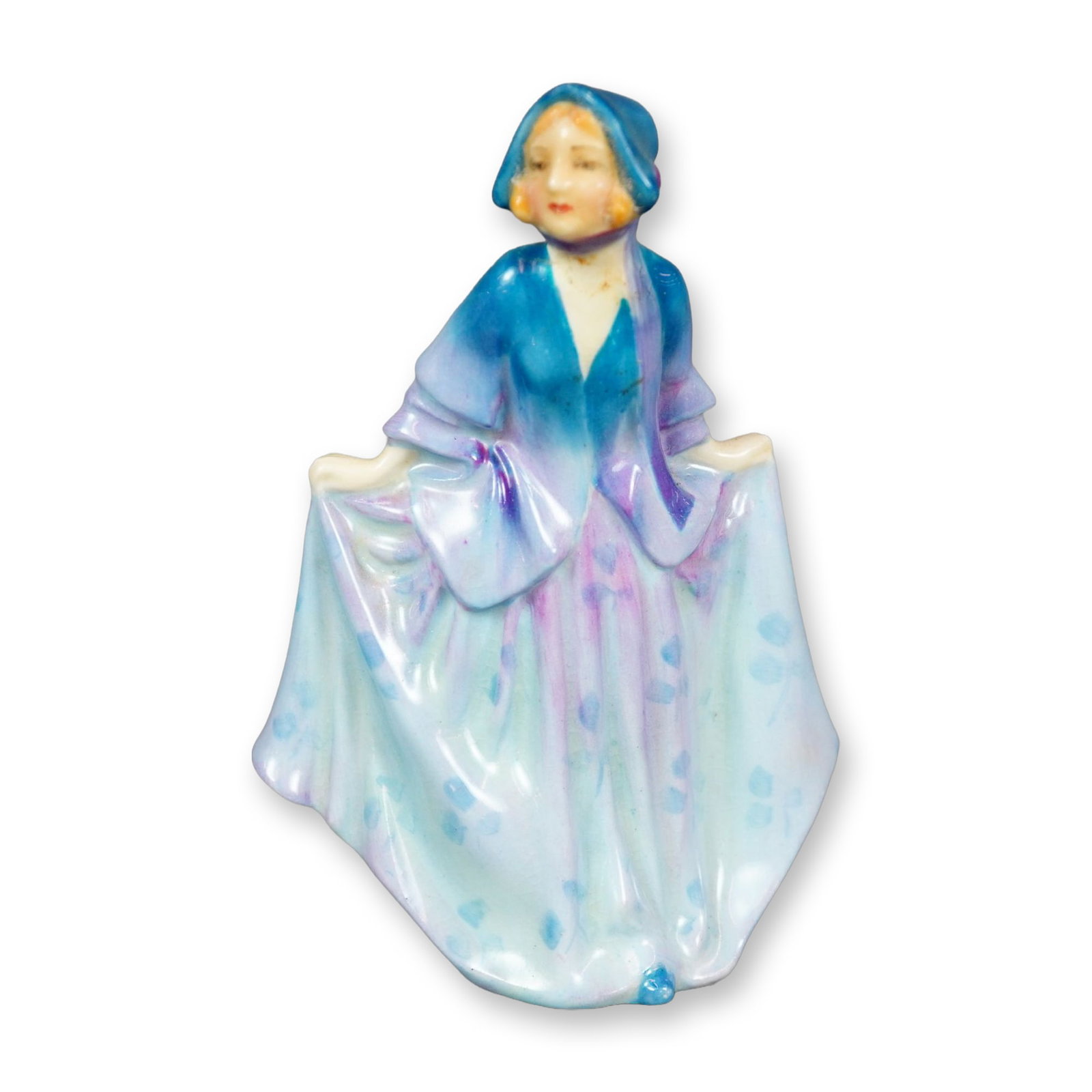 Royal Doulton Figurine, Sweet Anne M6: Hand painted figure of a young woman in a blue and purple dress with blue floral design. Royal Doulton backstamp. Dimensions: 2.75"L x 1.75"W x 4"H Manufacturer or Brand: Royal Doulton Country of Orig