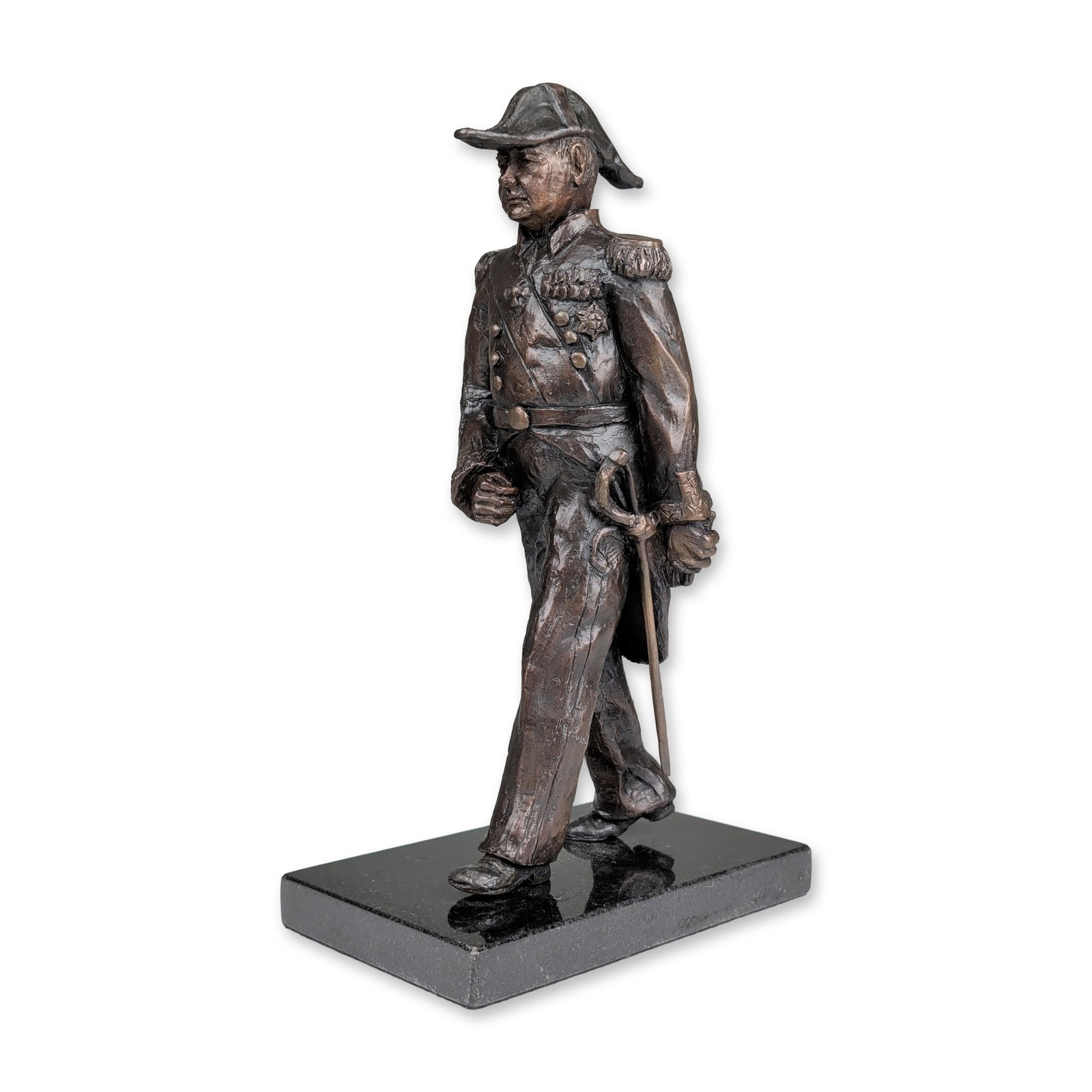 Winston Churchill Solid Bronze Military Sculpture: Featuring a finely textured surface with a rich dark brown patina, this sculpture depicts Winston Churchill attired in a bicorn hat and military frock coat, adorned with a prominent breast star and a 