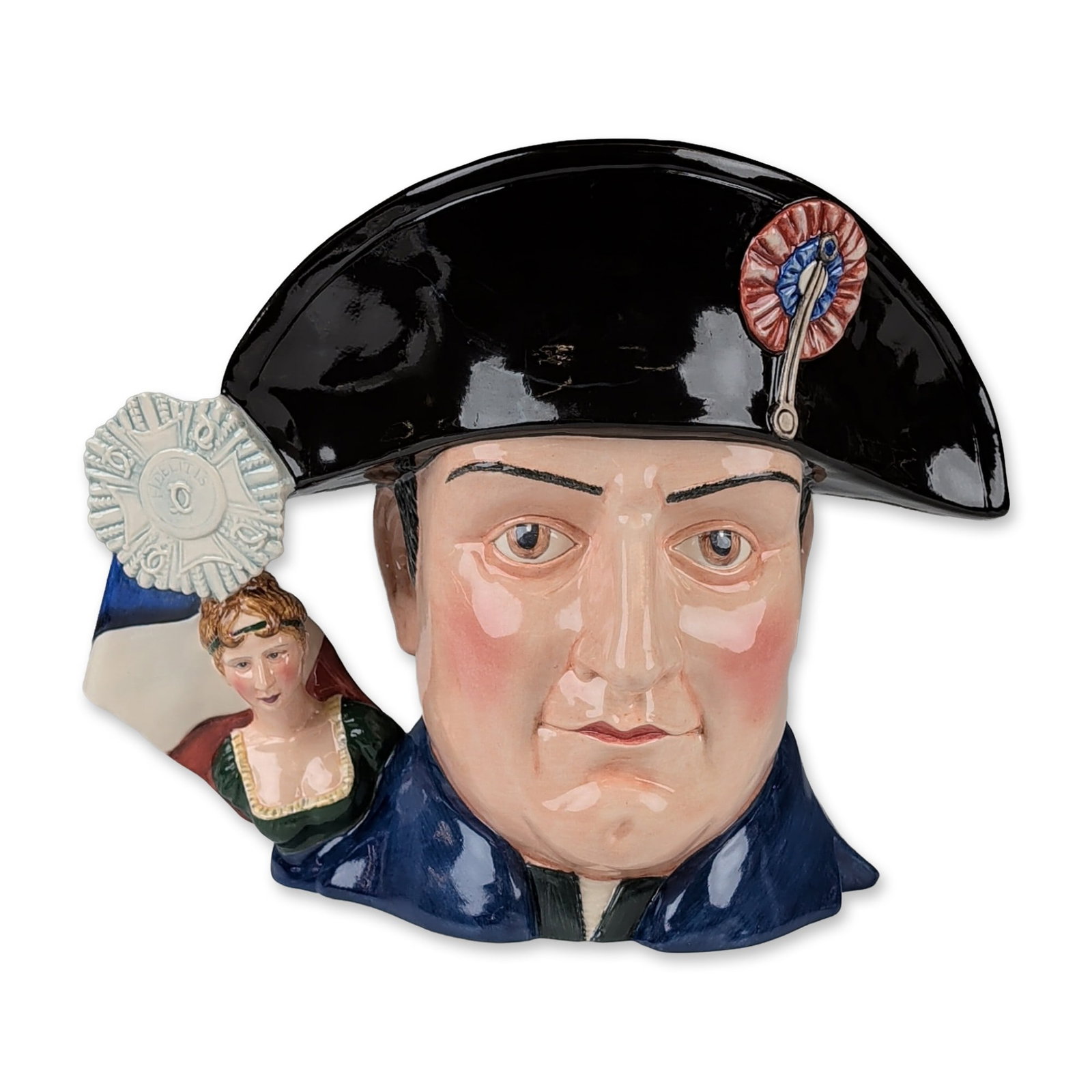 Royal Doulton Prototype Colorway Character Jug, Napoleon BonaparteD7237: In glazed ceramic, depicting Napoleon Bonaparte in a high-gloss black bicorne hat with a tricolor cockade and silver-toned pin. The figure is dressed in a dark blue military uniform, featuring a handl