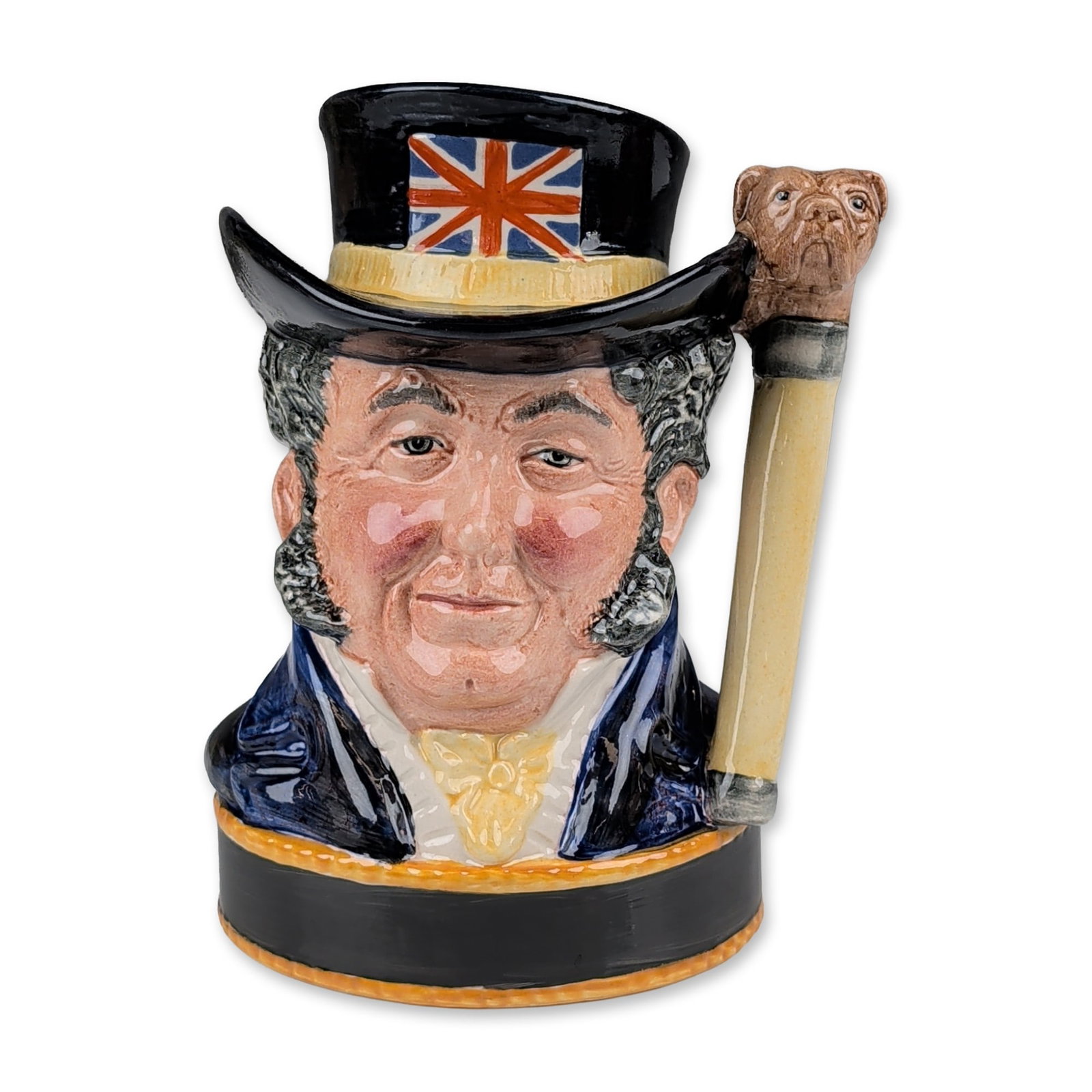 Royal Doulton Prototype Colorway Liquor Container Character Jug, John Bull: The figure is modeled wearing a black top hat with a hand-painted Union Jack, a dark blue coat, and a yellow waistcoat. The handle is sculpted in the form of a bulldog head atop a cream-colored walkin