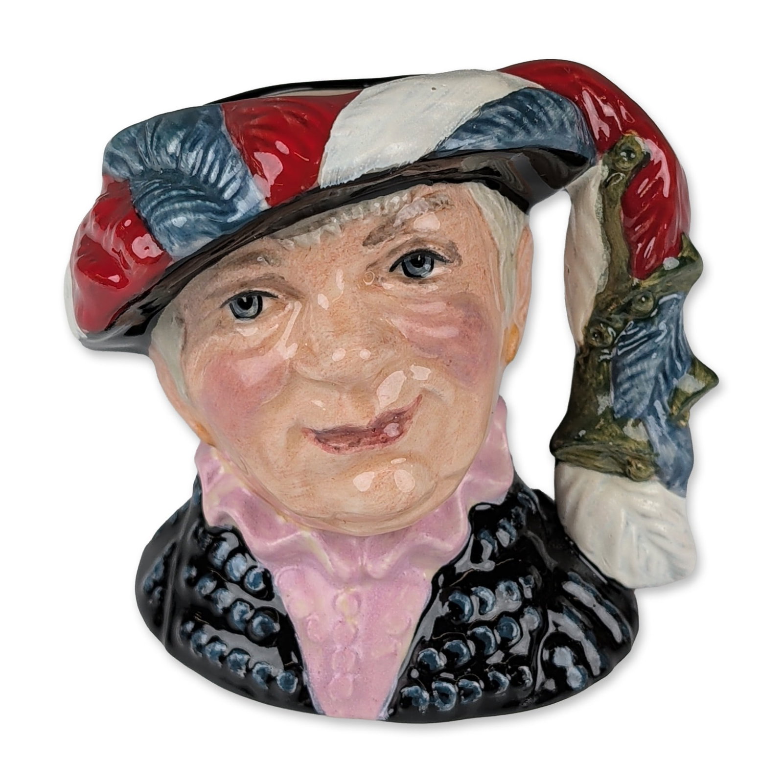 Royal Doulton Prototype Colorway Small Character Jug, Pearly Queen D6843: Polychrome glazed bone china depicting a woman in traditional London Pearly attire with a black coat featuring raised button decoration, a pink ruffled blouse, and a wide-brimmed feathered hat. The ha
