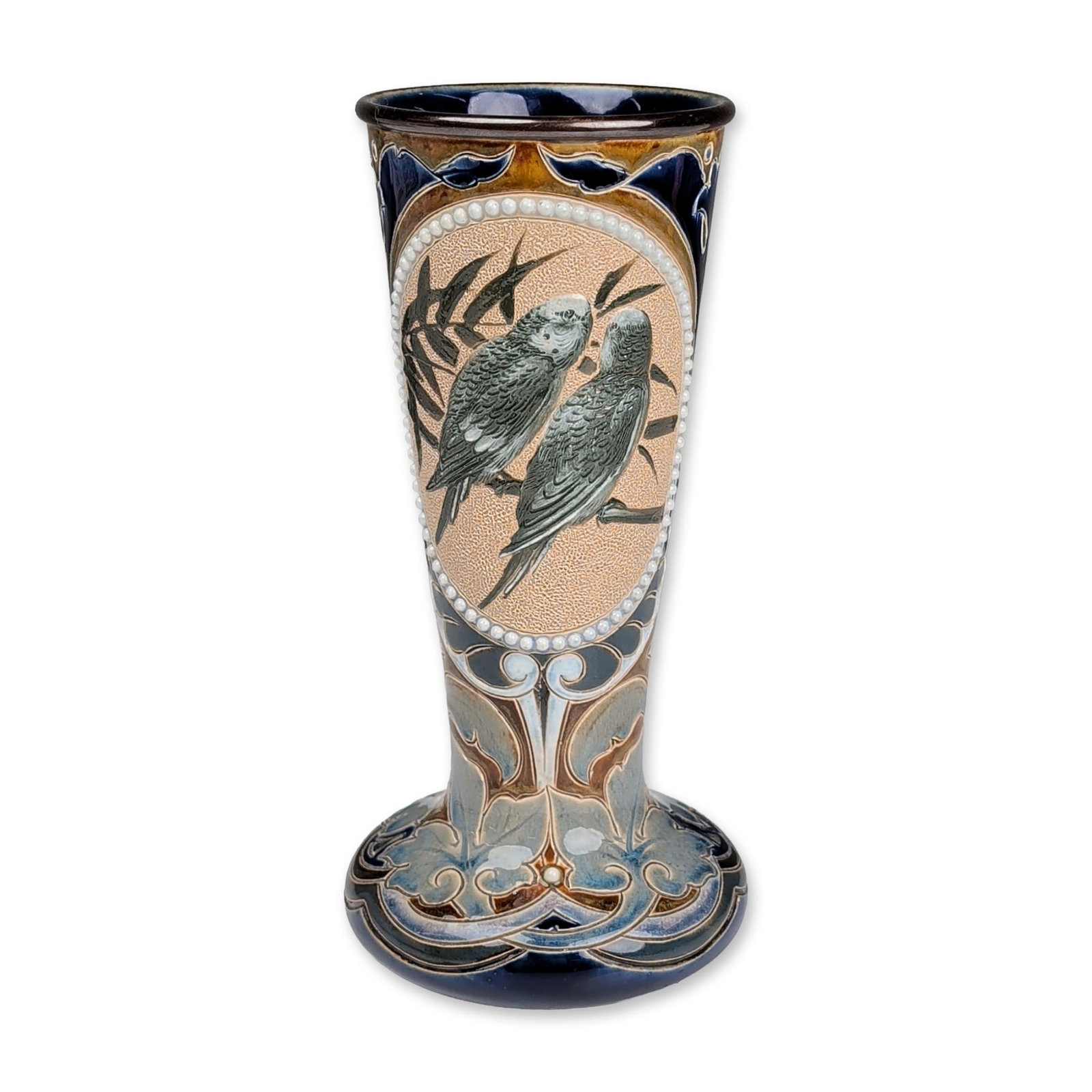 Doulton Lambeth by Florence Barlow and Emily Stomer Stoneware Vase, Budgerigar: Featuring two oval reserves decorated with pairs of pate-sur-pate budgerigars perched on branches against a textured buff ground. Each reserve is bordered by a double row of raised white slip-trailed 