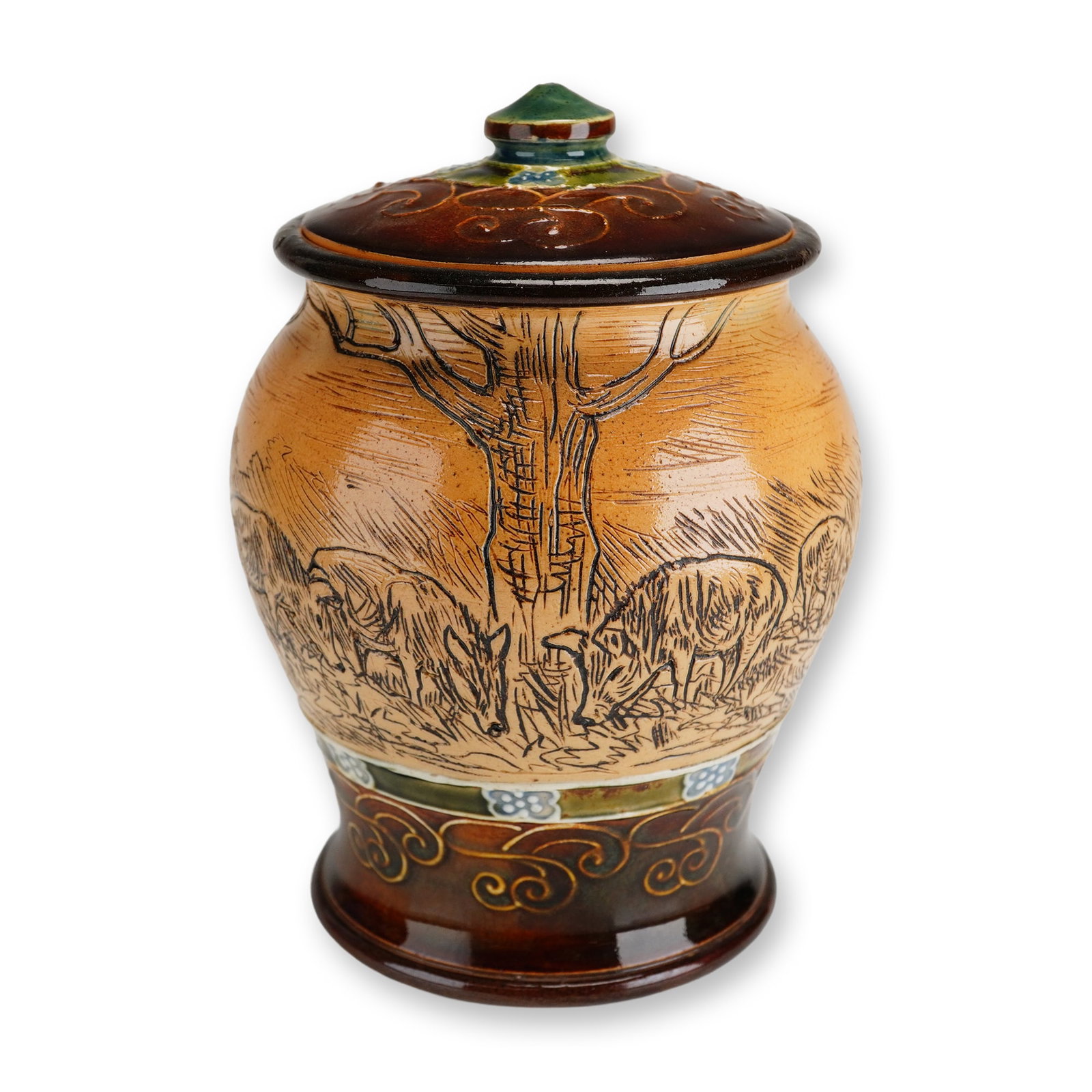 Doulton Lambeth by Hannah Barlow and Frank Butler Stoneware Lidded Jar, Pastoral Pigs: A Doulton Lambeth stoneware lidded jar finished in two-tone brown glaze with blue and green accents. The body features an incised pastoral scene of pigs grazing in a field, while the base and cover ar
