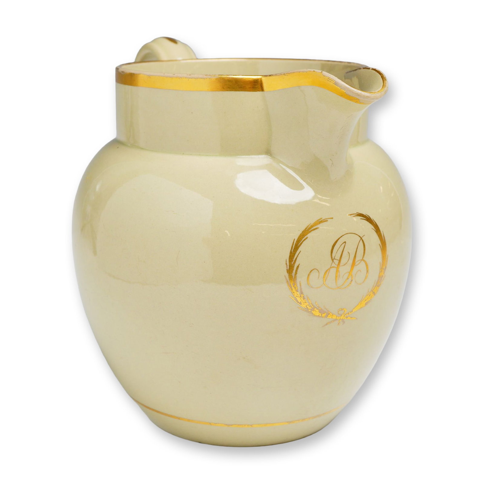 Wedgwood Drabware Dutch Jug: A Wedgwood drabware earthenware jug of Dutch form, dating to circa 1820. This pitcher features a smooth, unglazed-like drab-colored body accented with gilded highlights. The decoration includes a broa