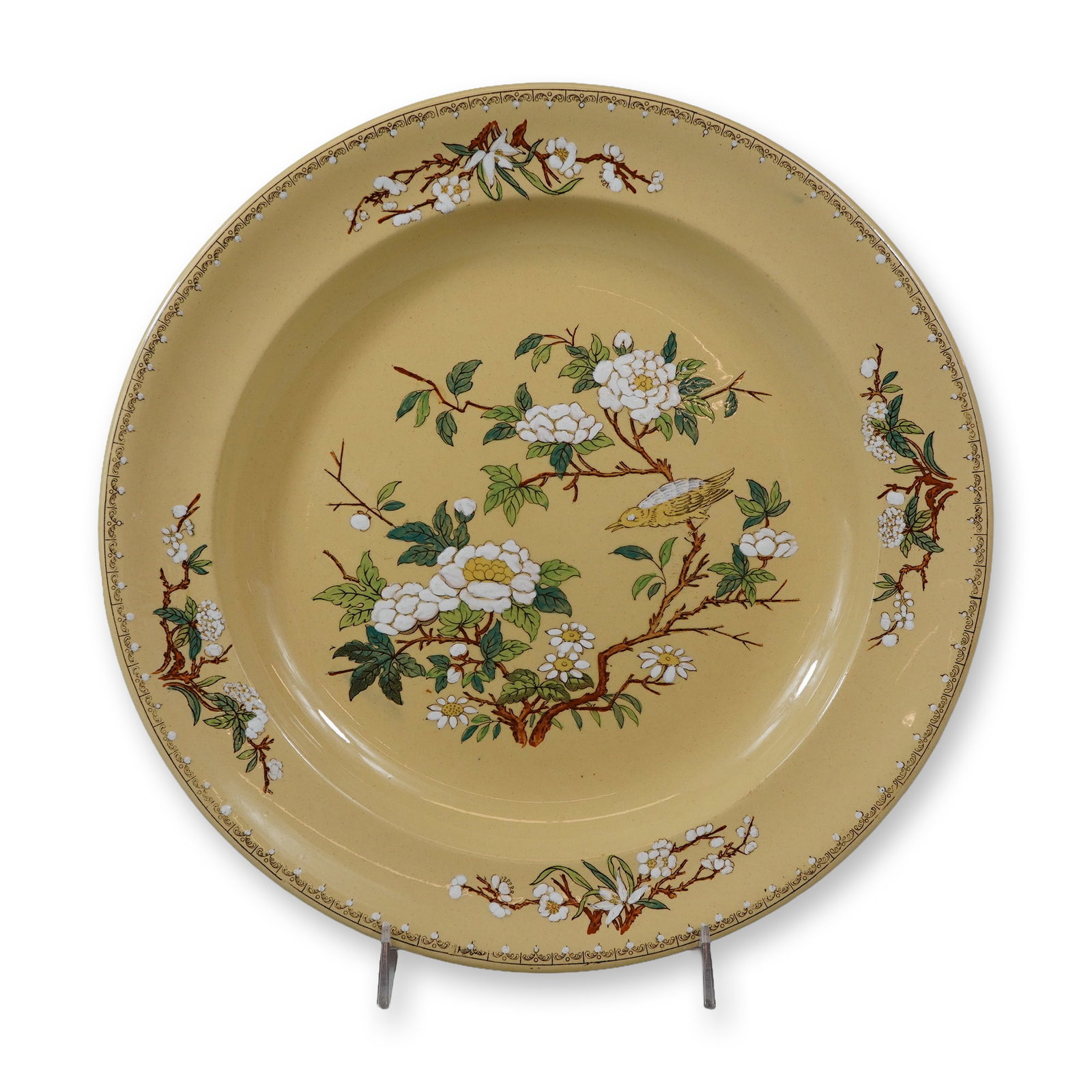 Wedgwood Etruria Yellow Ground Earthenware Charger, Cuckoo Pattern: This piece features the Cuckoo pattern on a pale yellow or primrose ground. The central well is decorated with a hand-painted polychrome enamel scene of a yellow bird perched upon a woody branch, surr