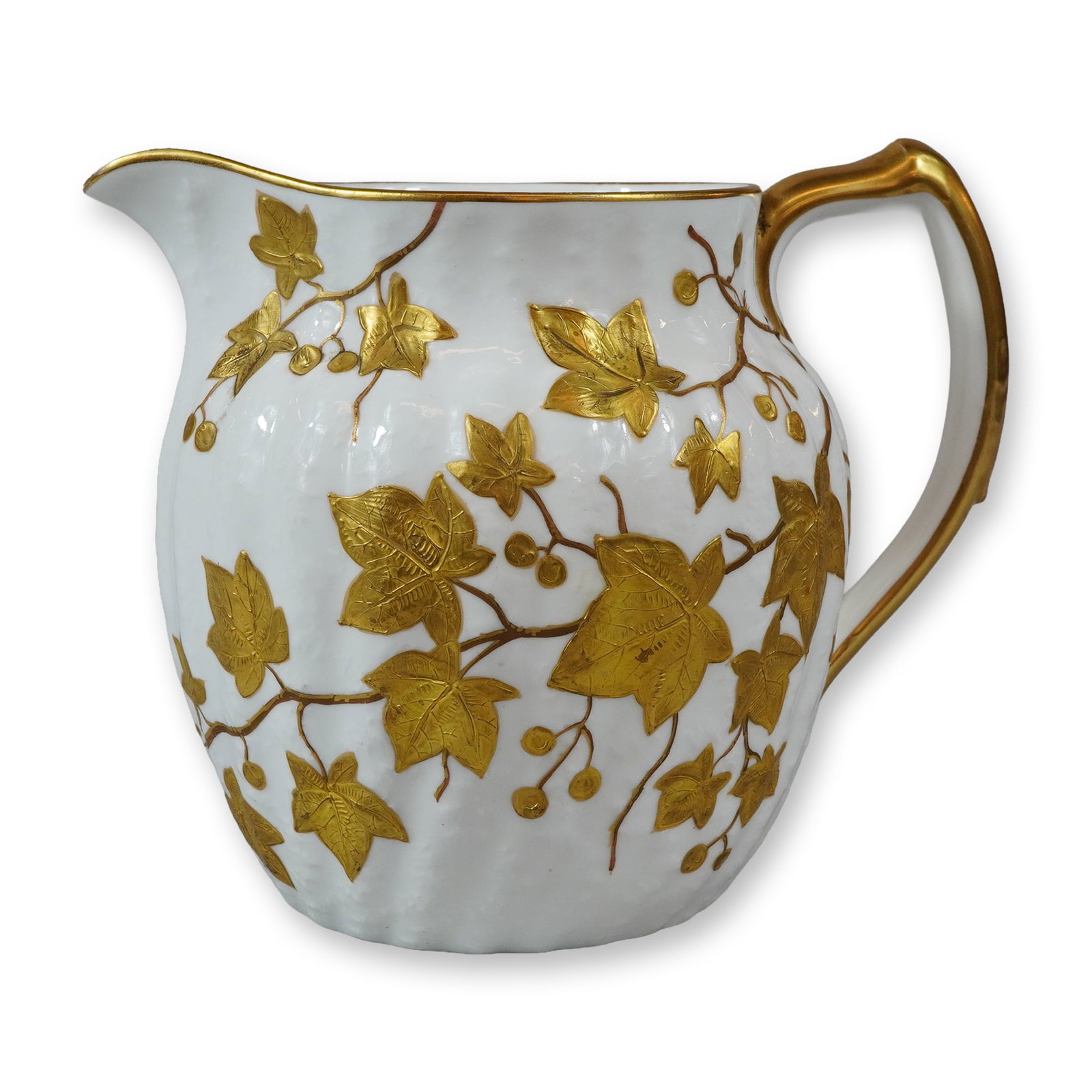 Wedgwood Victorian Gilded Ivy Pattern Bone China Pitcher: A Victorian bone china pitcher produced by the English firm Wedgwood. The vessel features a bulbous, vertically lobed body with a wide, pinched spout and a prominent high-set loop handle. The exterior