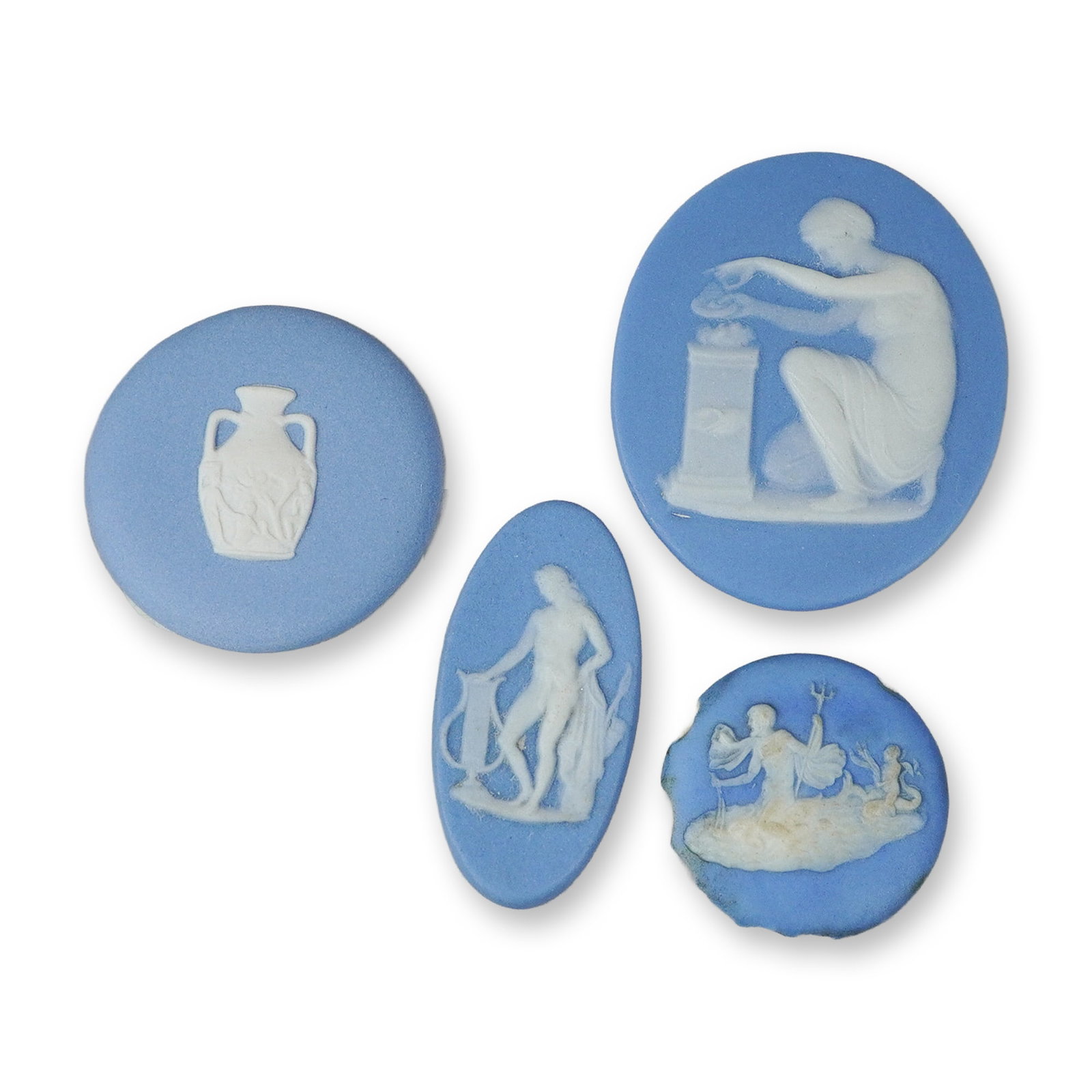 4pc Wedgwood Blue Jasperware Medallions and Cameos: This group consists of several individual jasperware cameos and medallions produced by the Wedgwood factory. Each piece is constructed from unglazed stoneware featuring a blue ground with white bas-re