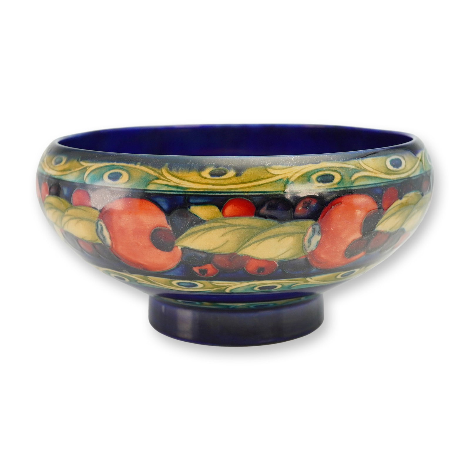Moorcroft Pottery Banded Pomegranate Bowl: A richly decorated Moorcroft Pottery bowl featuring the classic Banded Pomegranate pattern. The shallow, gently rounded form is adorned with Moorcroft’s signature tube-lined pomegranate motifs, fram