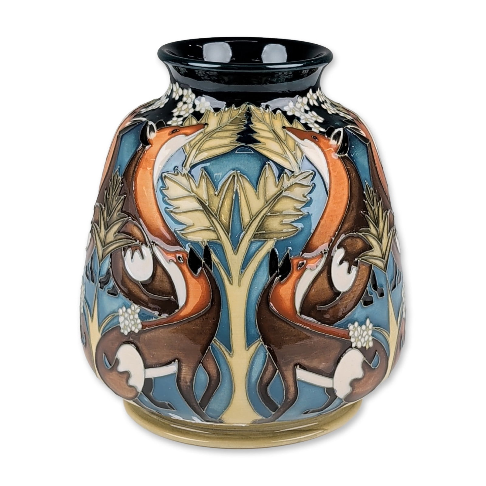 Moorcroft Pottery by Vicky Lovatt Fox Vase: Limited edition. Earthenware body with a bulbous form tapering to a flared rim, featuring tube-lined decoration with a symmetrical motif of stylized foxes, oak leaves, and white blossoms. Palette incl