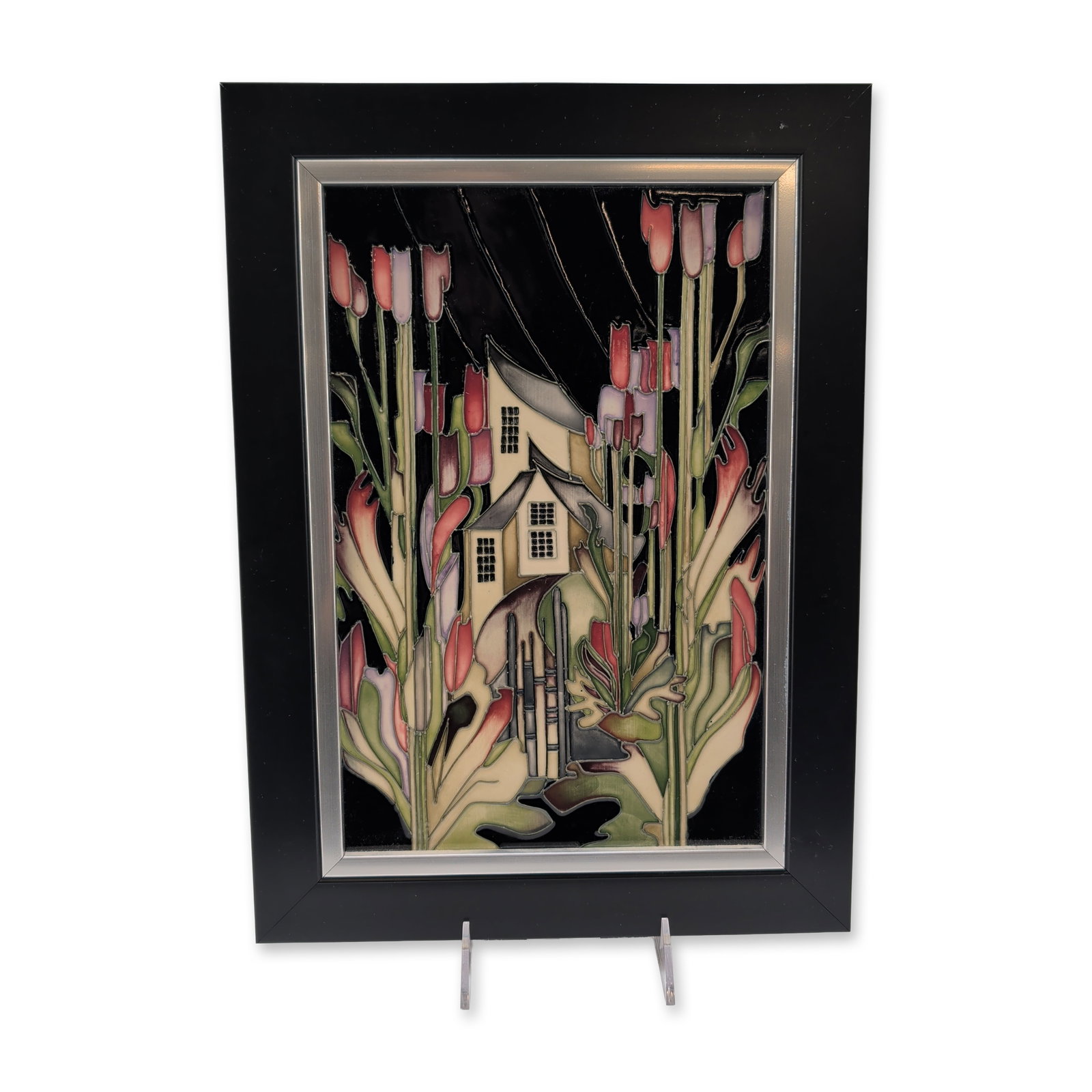 Moorcroft Pottery by Kerry Goodwin Large Framed Ceramic Plaque, Town of Flowers: Featuring a stylized house surrounded by elongated floral forms in pink, purple, and green. Hand-painted on a black ground. Signed 'Kerry Goodwin' and numbered 118 of 250. Verso includes impressed Moo