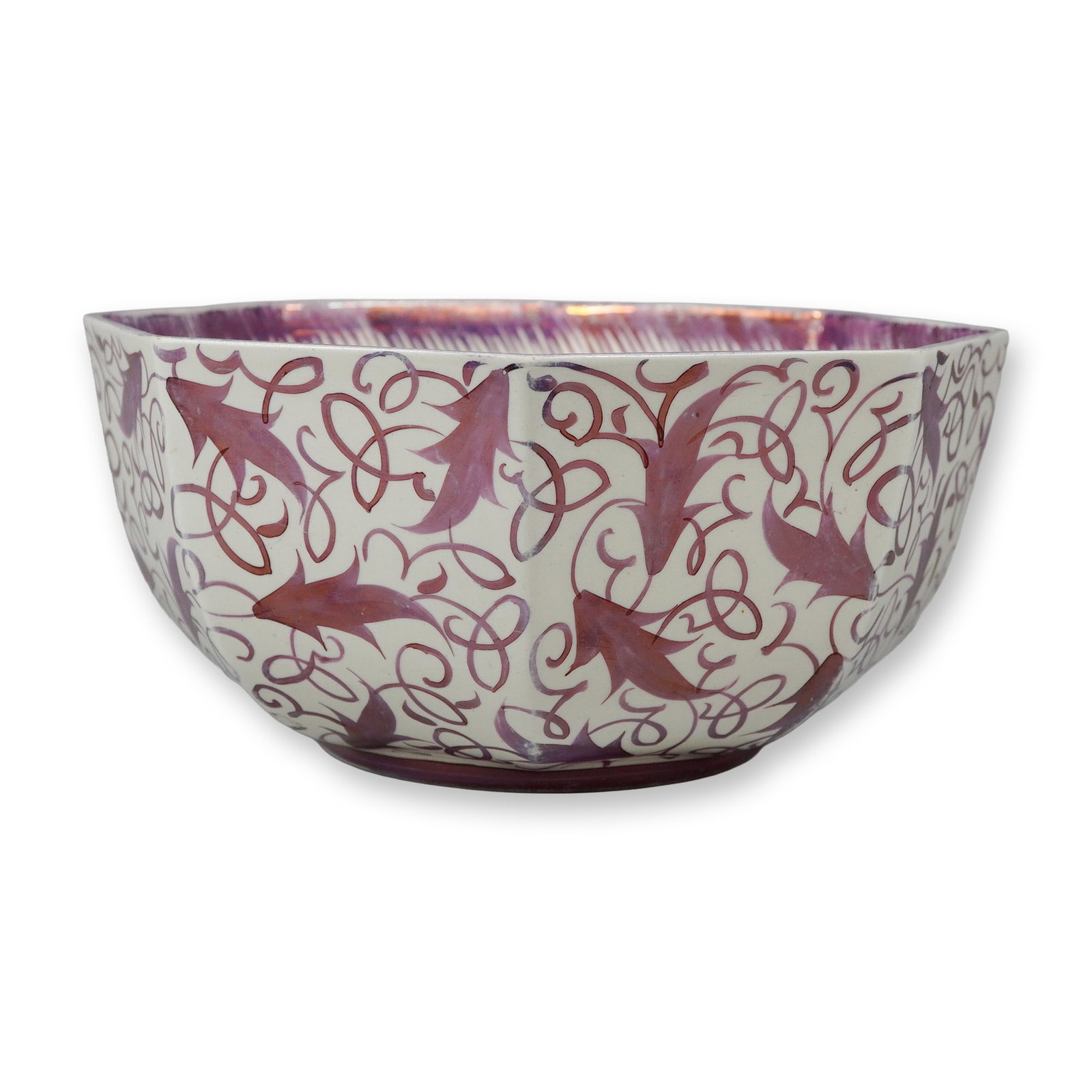 Wedgwood Hand-Painted Lustre Octagonal Bowl: A large Wedgwood earthenware bowl of octagonal form with a circular foot. The exterior is decorated with a repeating hand-painted lustre pattern featuring leaves intertwined with scrolling vines in a 