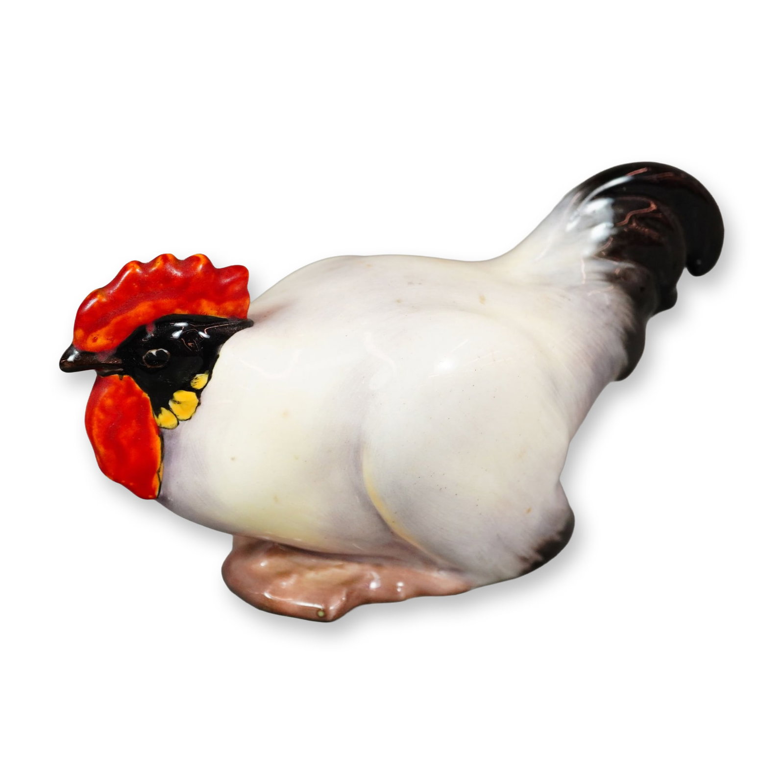 Royal Doulton Porcelain Bird Figurine, Cockerel Crouch HN124: Hand-painted figurine of a resting chicken in cream, black, and red tones, featuring a Royal Doulton backstamp. Dimensions: 5.75"L x 2.5"W x 3"H Manufacturer or Brand: Royal Doulton Country of Origin: