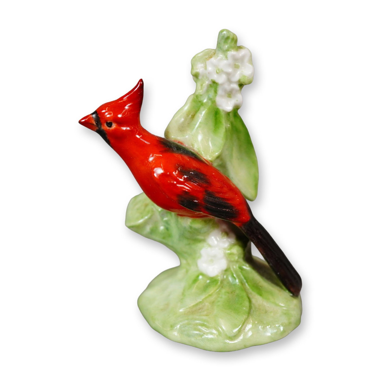 Royal Doulton Bone China Figurine, Cardinal K28: Hand-painted porcelain figure of a vibrant red cardinal accented with black detailing, depicted standing beside white blossoms. The underside bears the Royal Doulton backstamp. Dimensions: 2.25"L x 1.