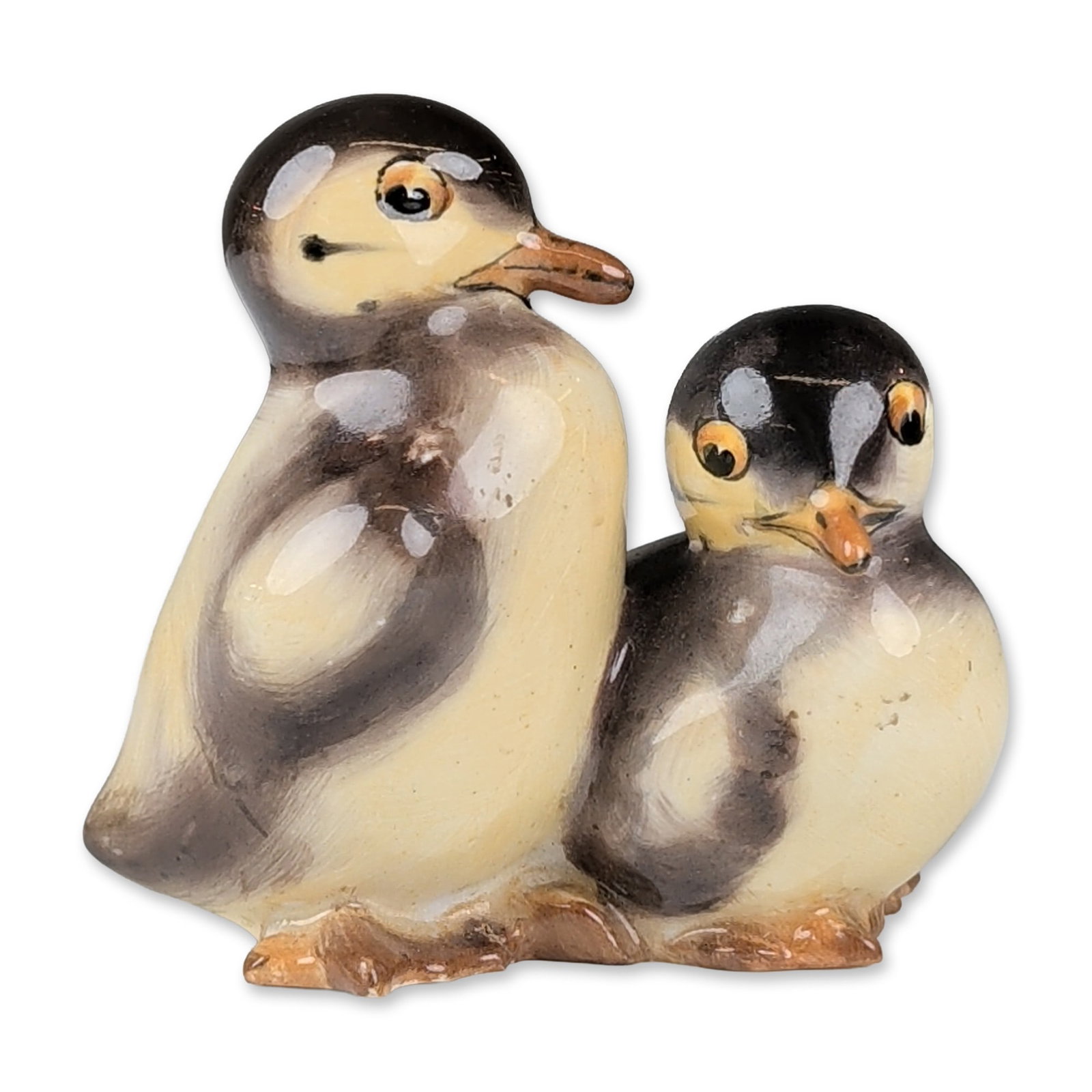 Royal Doulton Porcelain Figurine, Ducklings Standing HN206: The figure features two huddled ducklings naturalistically modeled with cream and pale yellow bodies and dark grey-brown plumage markings. Features include orange-painted beaks and dark eyes. Undersid